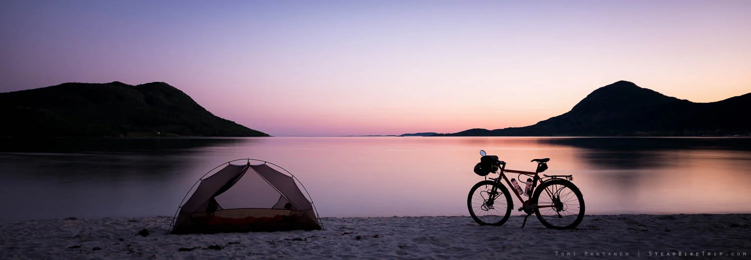 Bike and tent at beach in Helgeland.