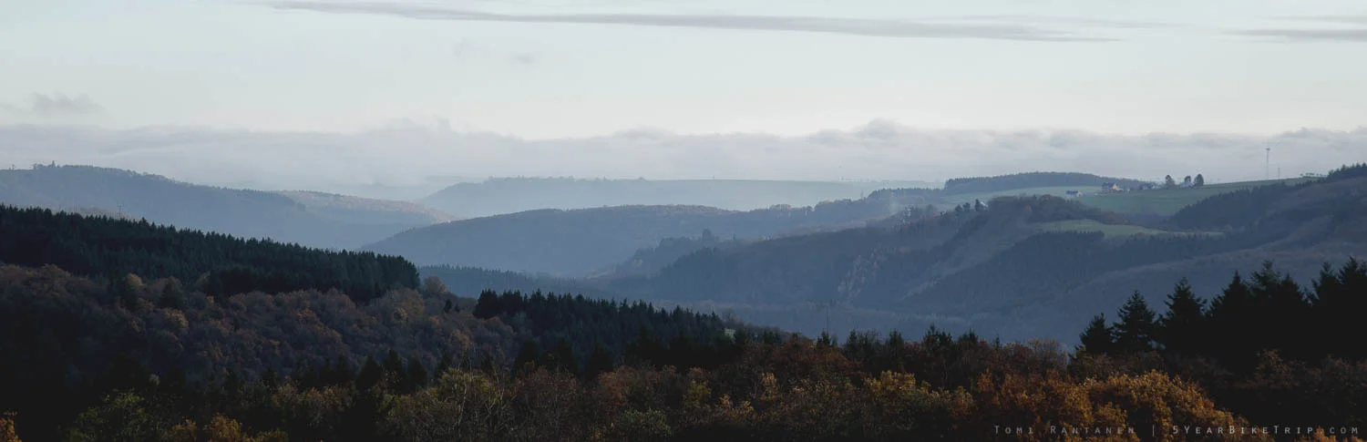 Typical view in Luxembourg: Rolling hills and forest.