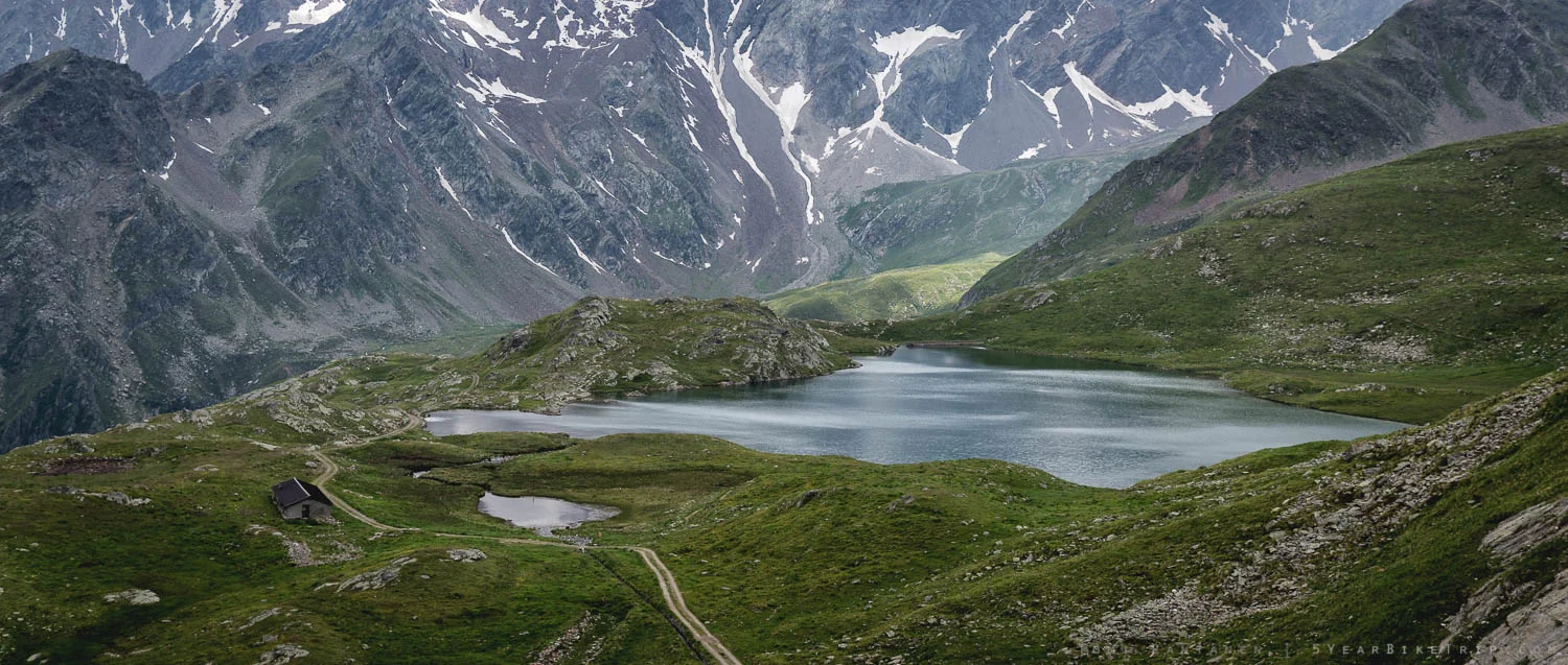 Lago Nero, a farm house, and a mountain biking road.