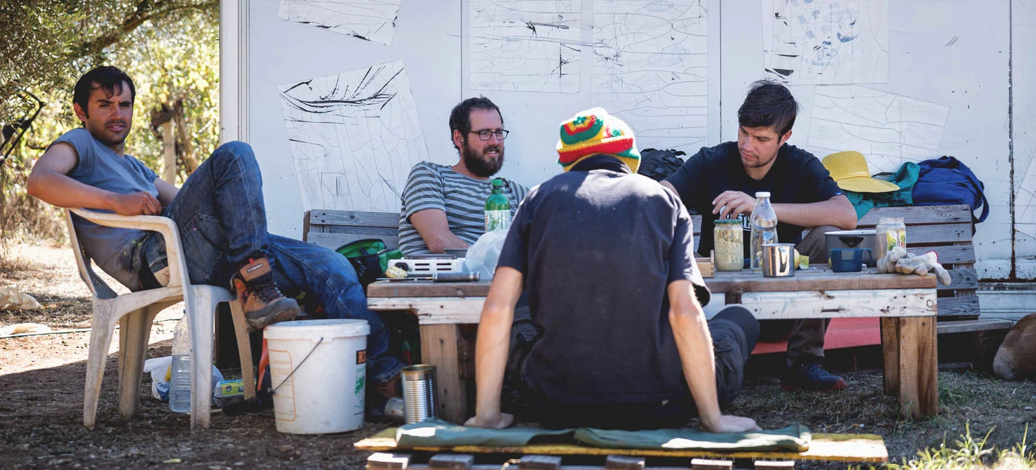 Ivan, Eric, Bambi and Amir sitting down for breakfast.