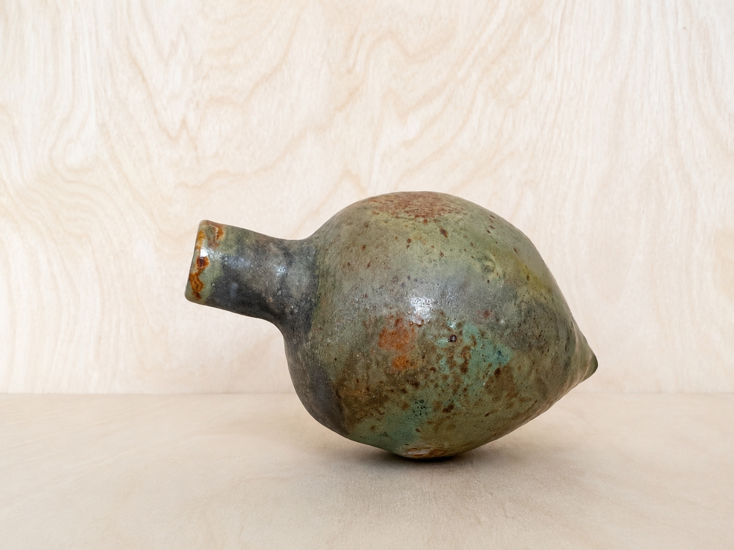 Hand-built sage ceramic vessel.png