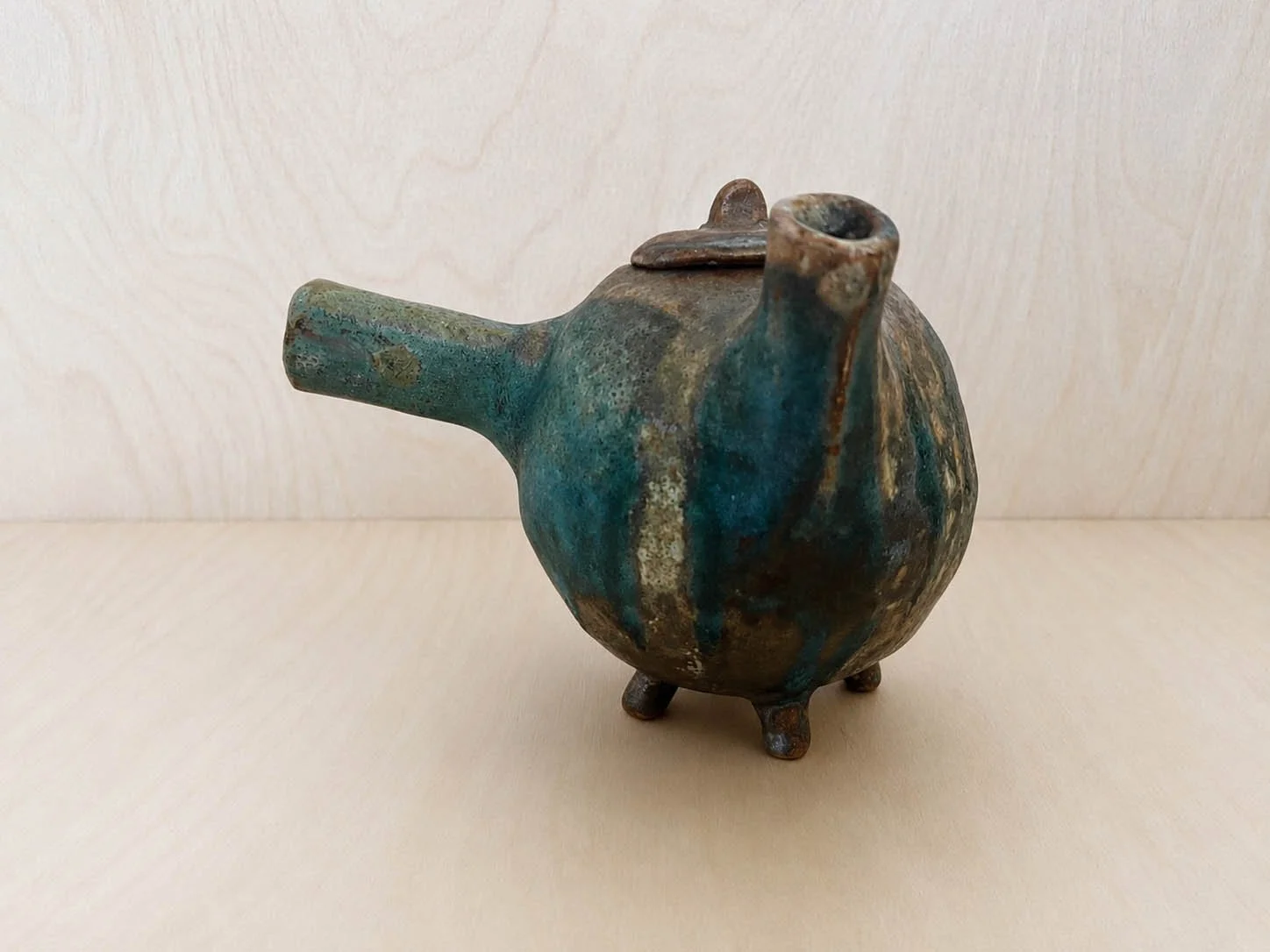 Teal-glazed handmade ceramic vessel.jpg