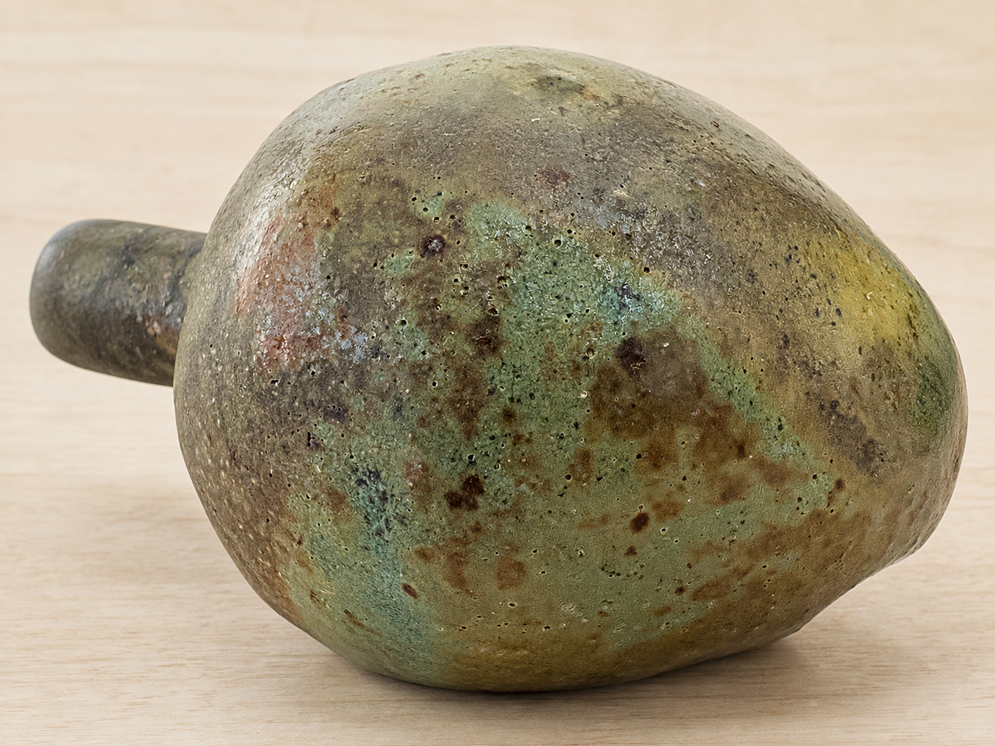 Hand-Built Ceramic Vessel on Pale Wood(2).png