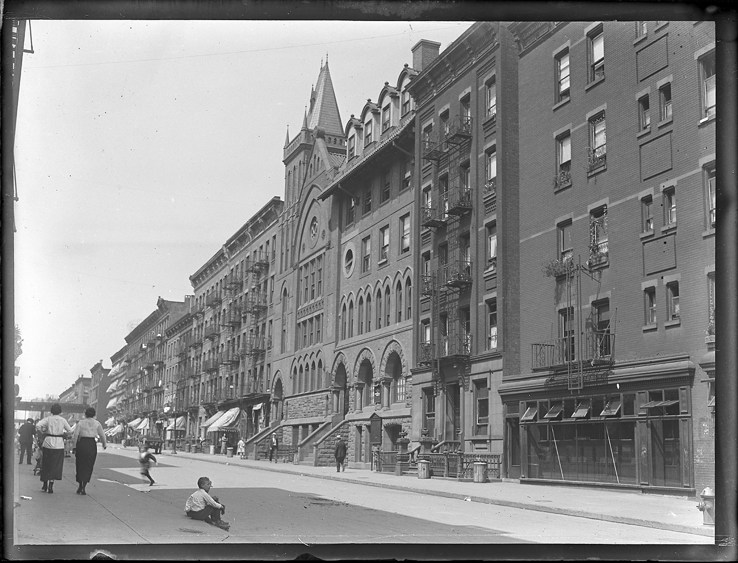 Viewing looking west on 74th St. between 1st and 2nd Ave. The Jan Hus Presbyterian Church is the tallest building.
