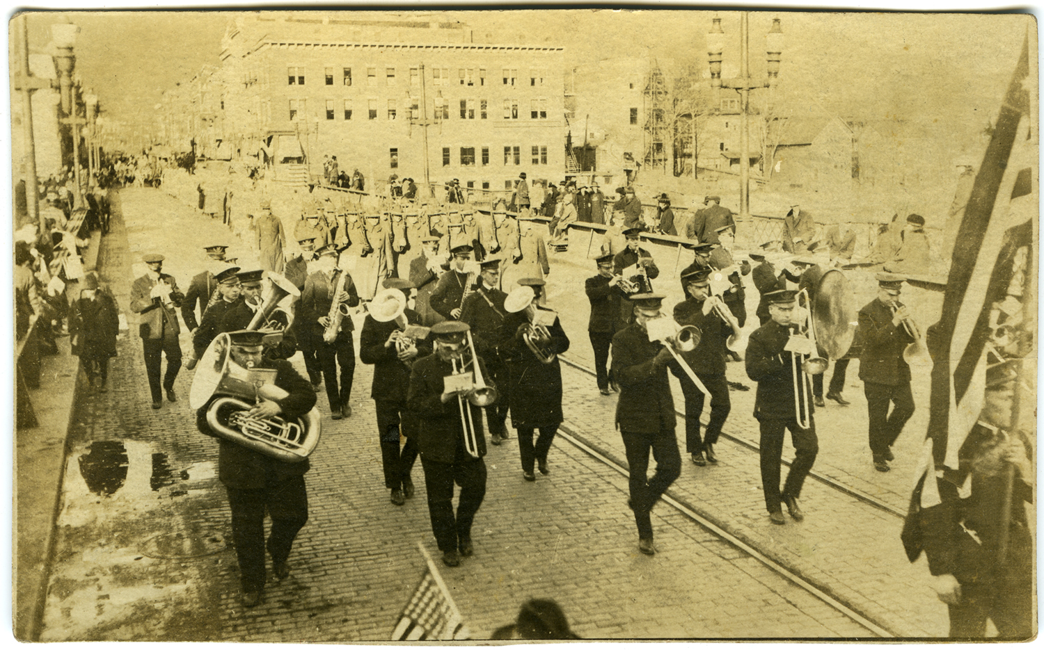 Printed as a photo postcard. "Peace Day at Salamanca NY. Nov. 11, 1918. Was playing one of your old favorites "Bombasto" when this was snapped. Best Regards."