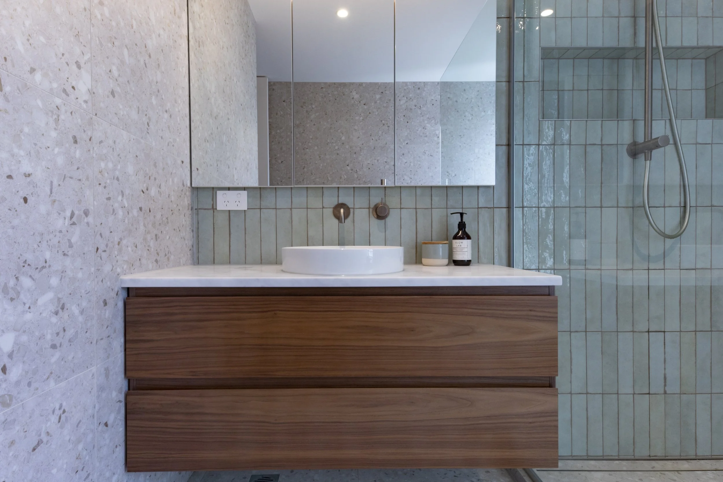 Timber vanity with light blue tiles