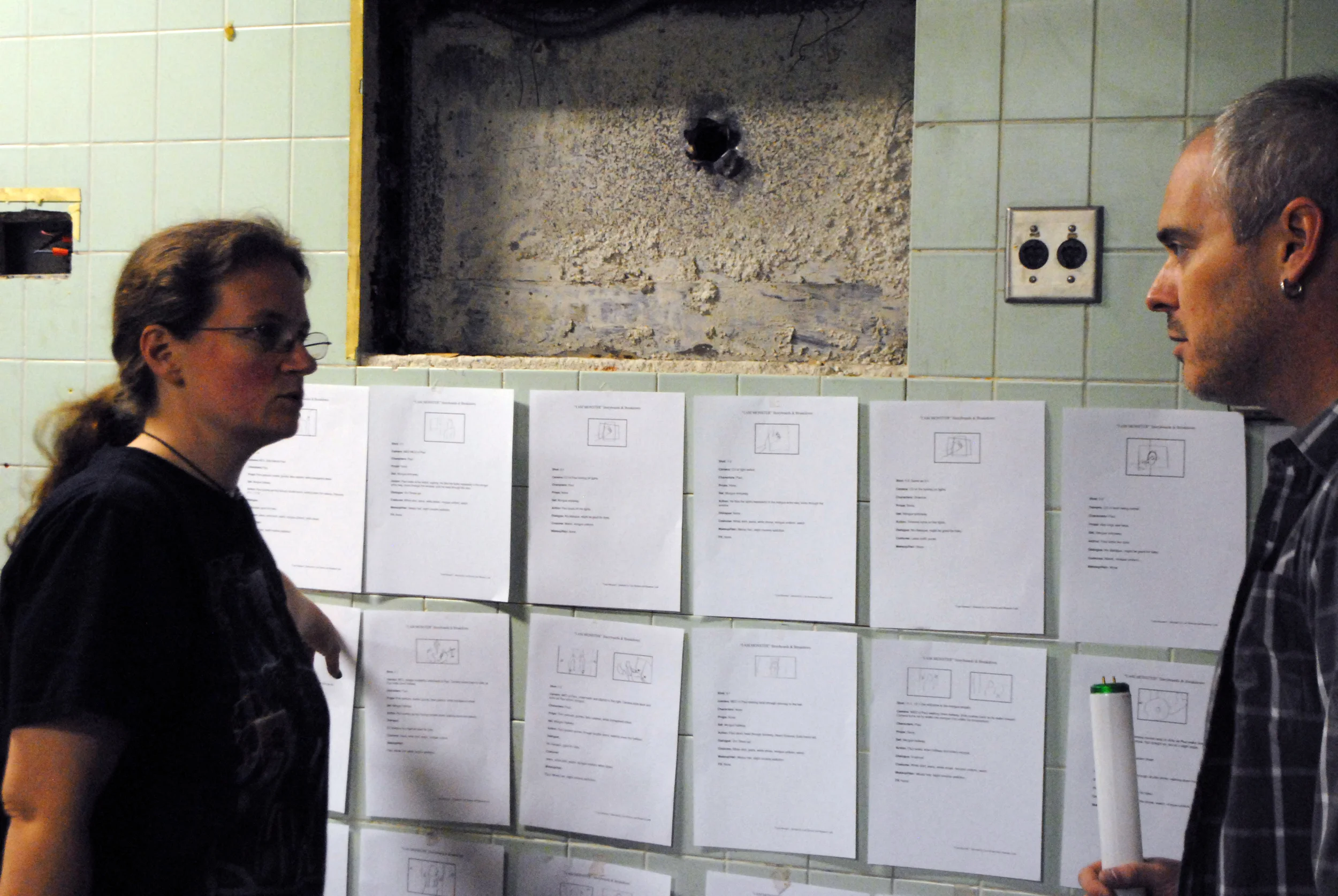 Co-director Lori Bowen going over storyboards with gaffer Jim Kunz.