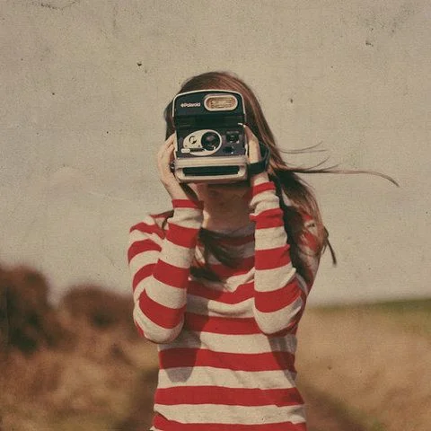 young girl with polaroid.jpg
