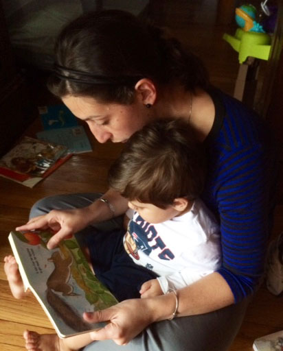 Momma and kiddo enjoy some much beloved reading time with The Busy Little Squirrel by Nancy Tafuri.