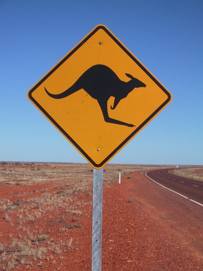 "Kangaroo Sign at Stuart Highway" by Jpp - Made by Jpp. Licensed under CC BY-SA 3.0 via Wikimedia Commons - Link