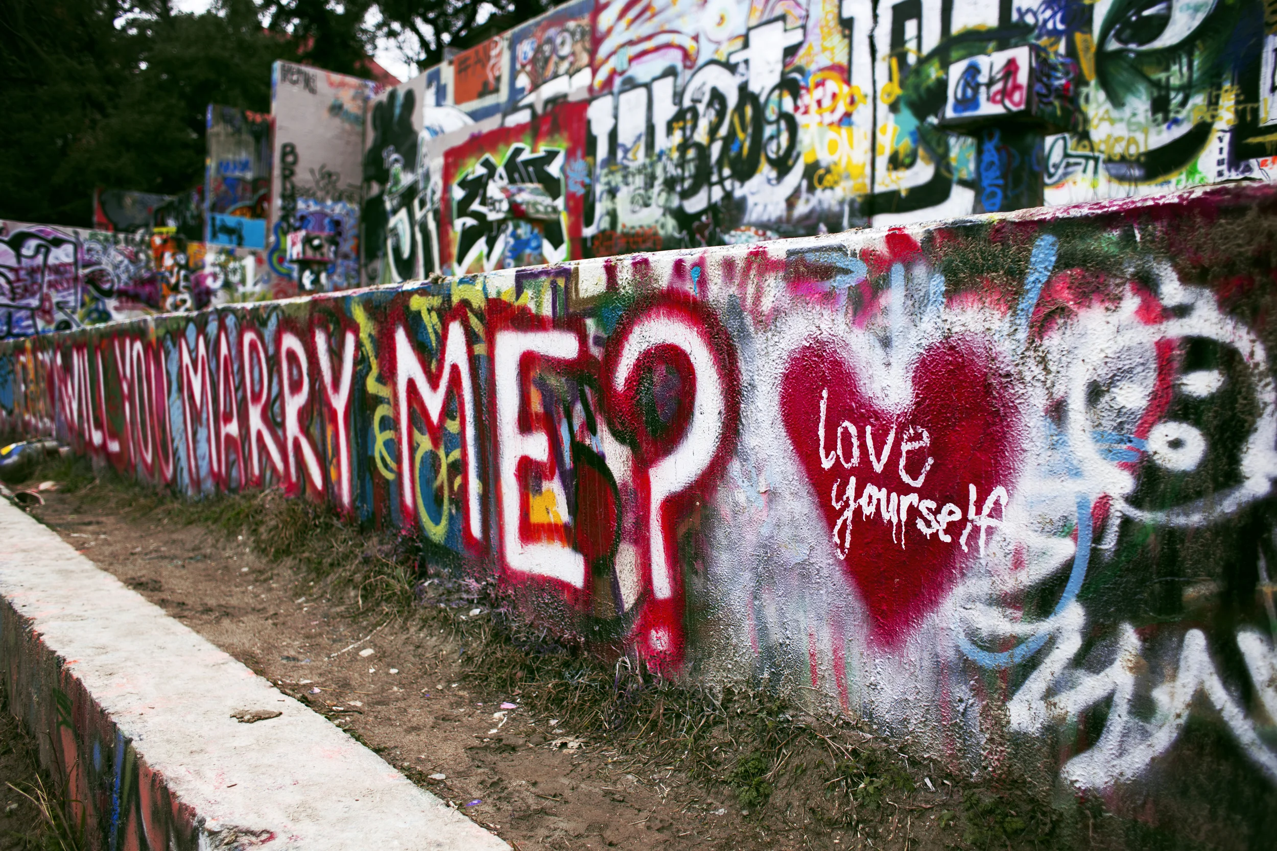 Day 12 - Austin TX Hope Outdoor Gallery Nice place to chill and people watch. A place where the walls are constantly changing with different artwork and messages. This one was my favorite. Makes me wonder if someone proposed here recently...