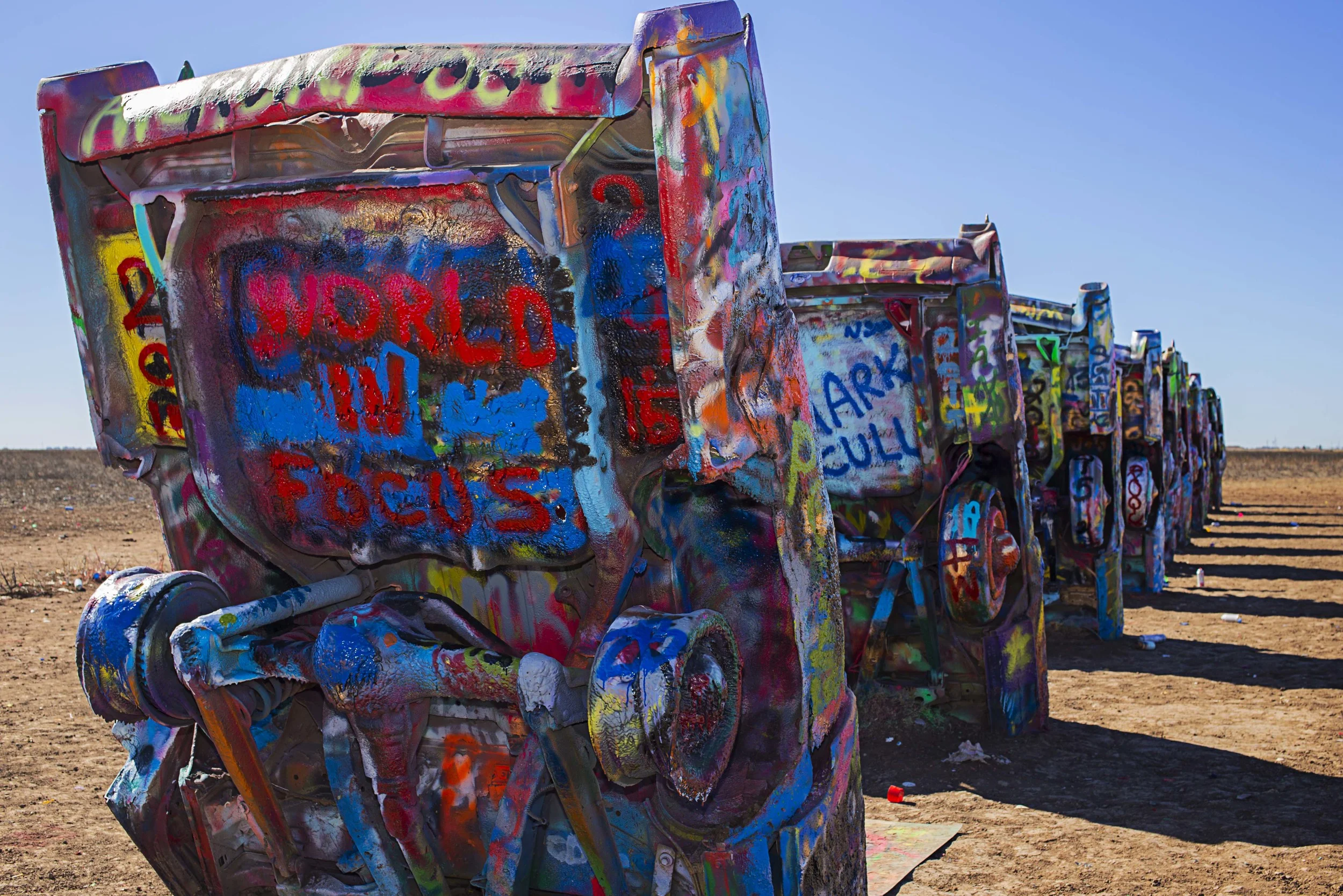 Day 17 - Amarillo, TX We couldn't pass up a chance to stop by Cadillac Ranch on our way to Santa Fe, NM. Here you will find literally old Cadillacs buried into the ground where you are encouraged to express yourself. Don't mind if we do!