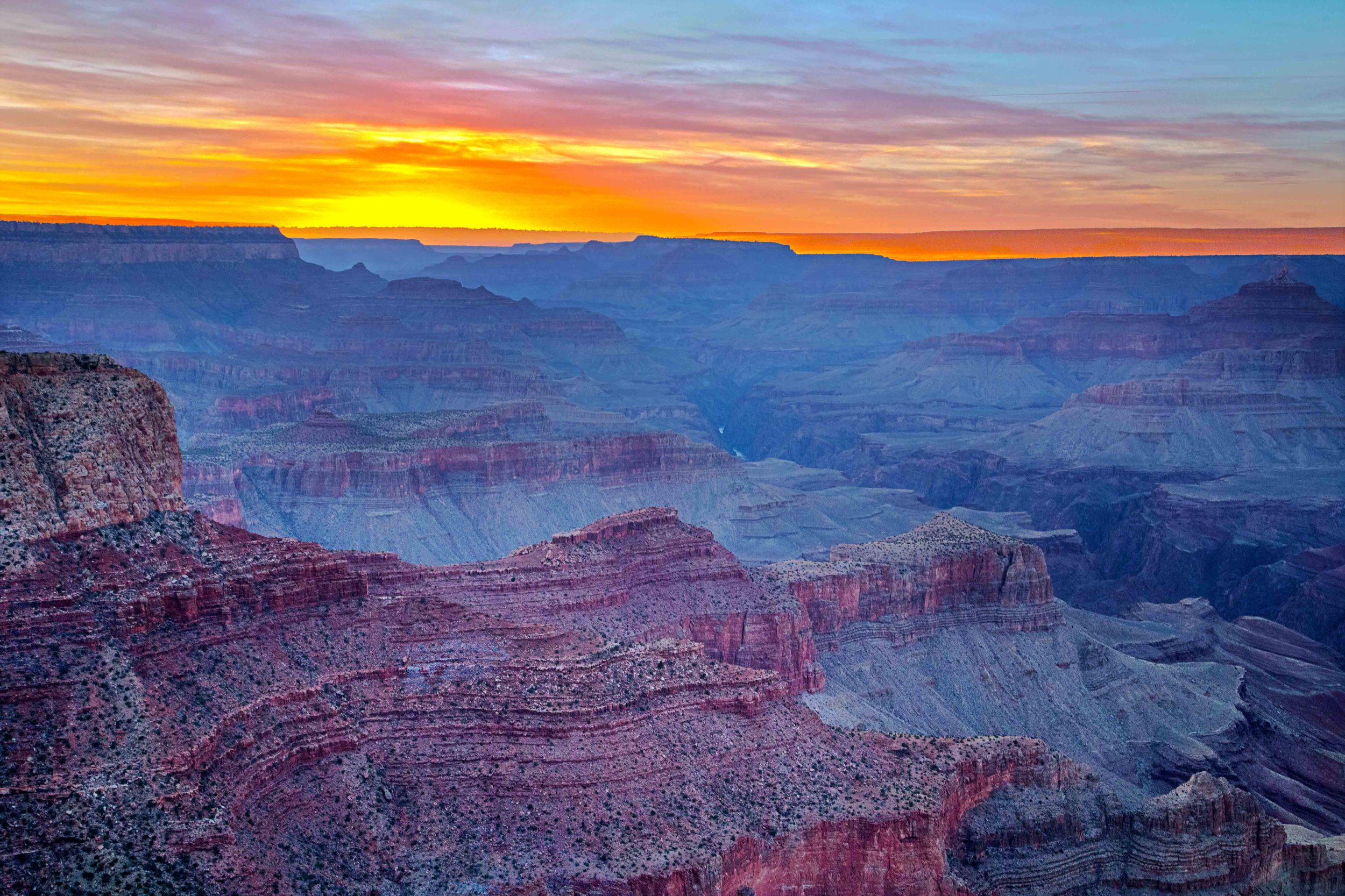 Day 23 - Grand Canyon National Park One of the 7 natural wonders of the world. It was another long drive from Zion to the Grand Canyon, and we made it just in time for a spectacular sunset. You can even see a slither of the colorado river Barely any visitors and those who were there left before the real sunset colors emerged. Next is hiking the canyon! 