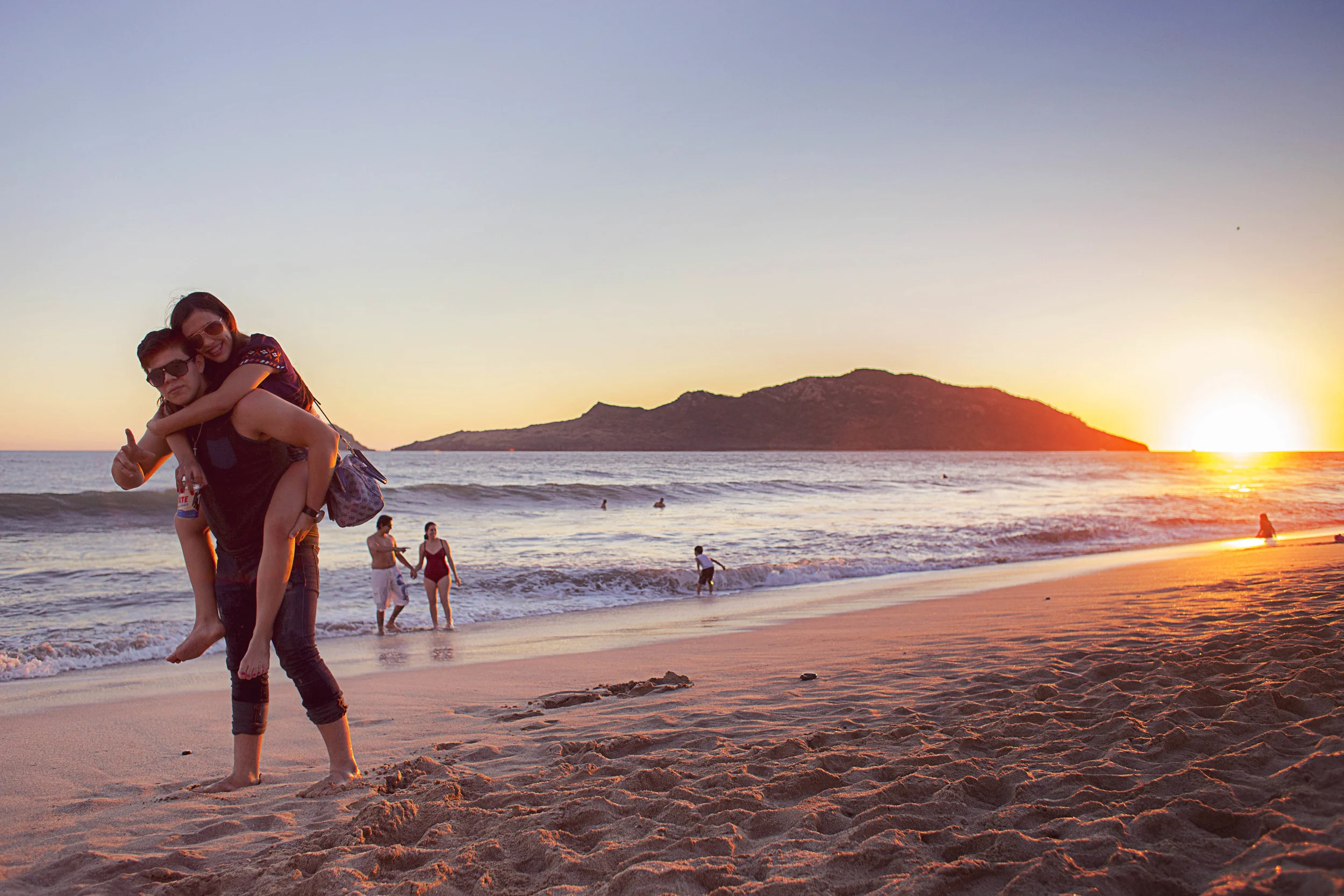 Day 56 - Mazatlan, Sinaloa, Mexico We arrived at the beach on a Friday which ensured a lively weekend. We decided to head to the beach for sunset where we saw this cute young couple who were visiting from Culiacán, Sinaloa celebrating their 2 year anniversary.