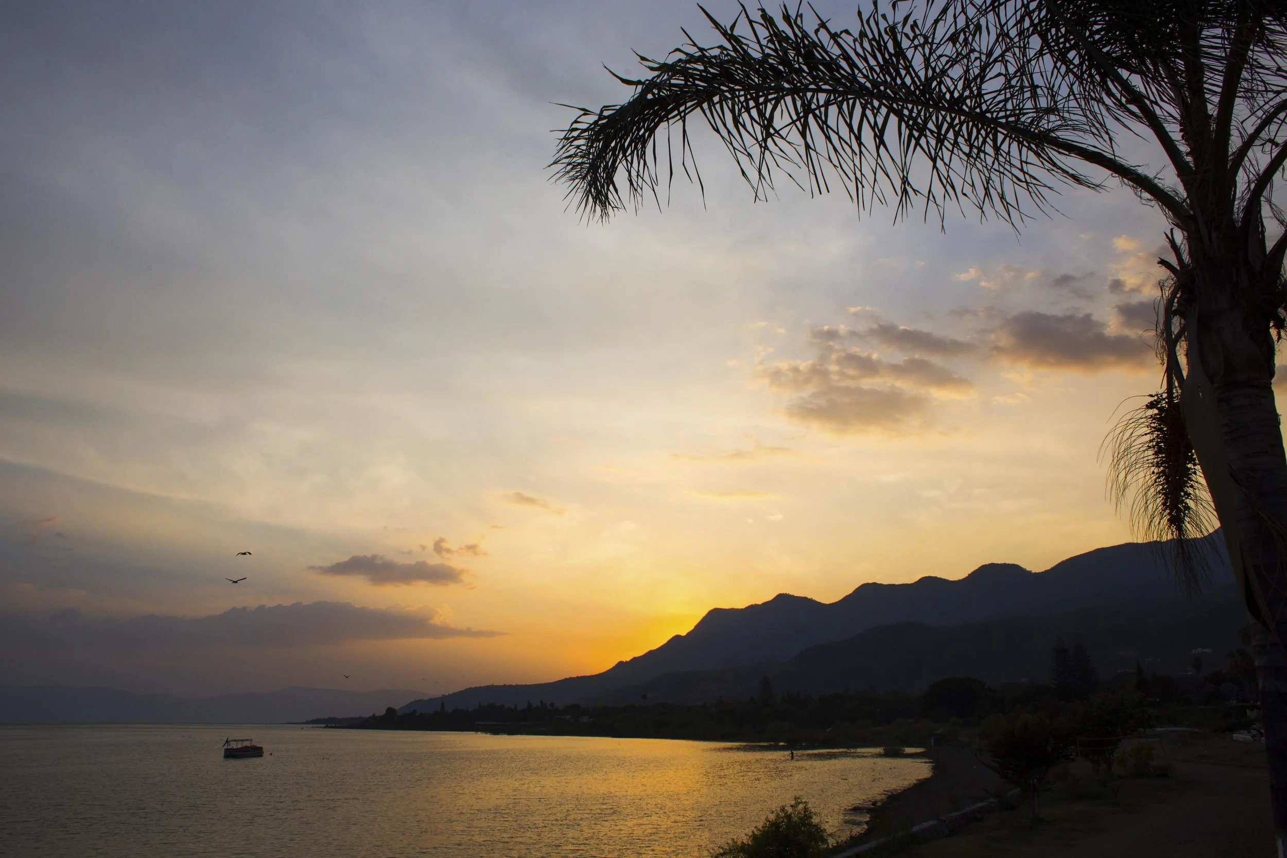 Day 74 - Ajijic, Jalisco, Mexico A super cute town sitting by the largest lake in Mexico, Lake Chapala. You can see the light blue colored mountains in the distance on other side of the lake. The weather is great year round and now know why so many people like to retire here.