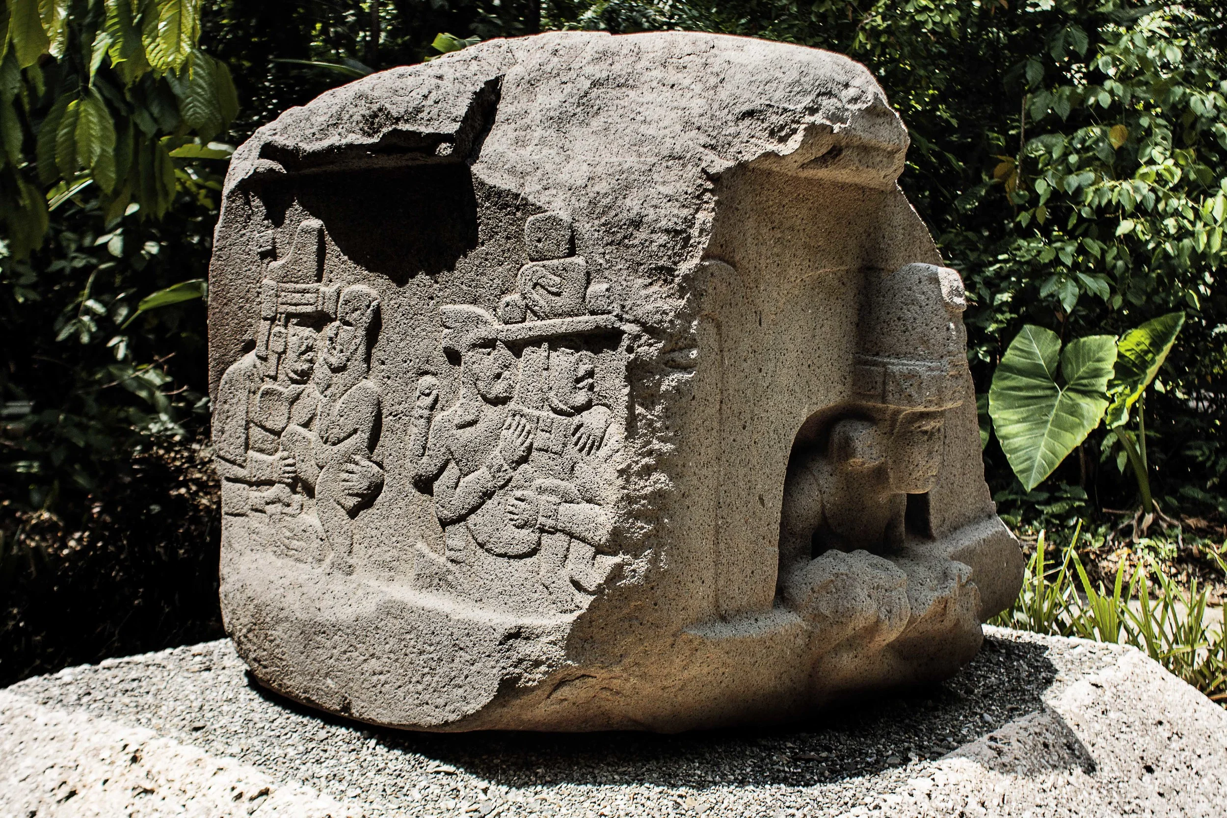Day 122 - Villahermosa, Tabasco, Mexico Altar 5 from La Venta Park-Museum. The inert were-jaguar baby held by the central figure is seen by some as an indication of child sacrifice. In contrast, its sides show bas-reliefs of humans holding quite lively were-jaguar babies.