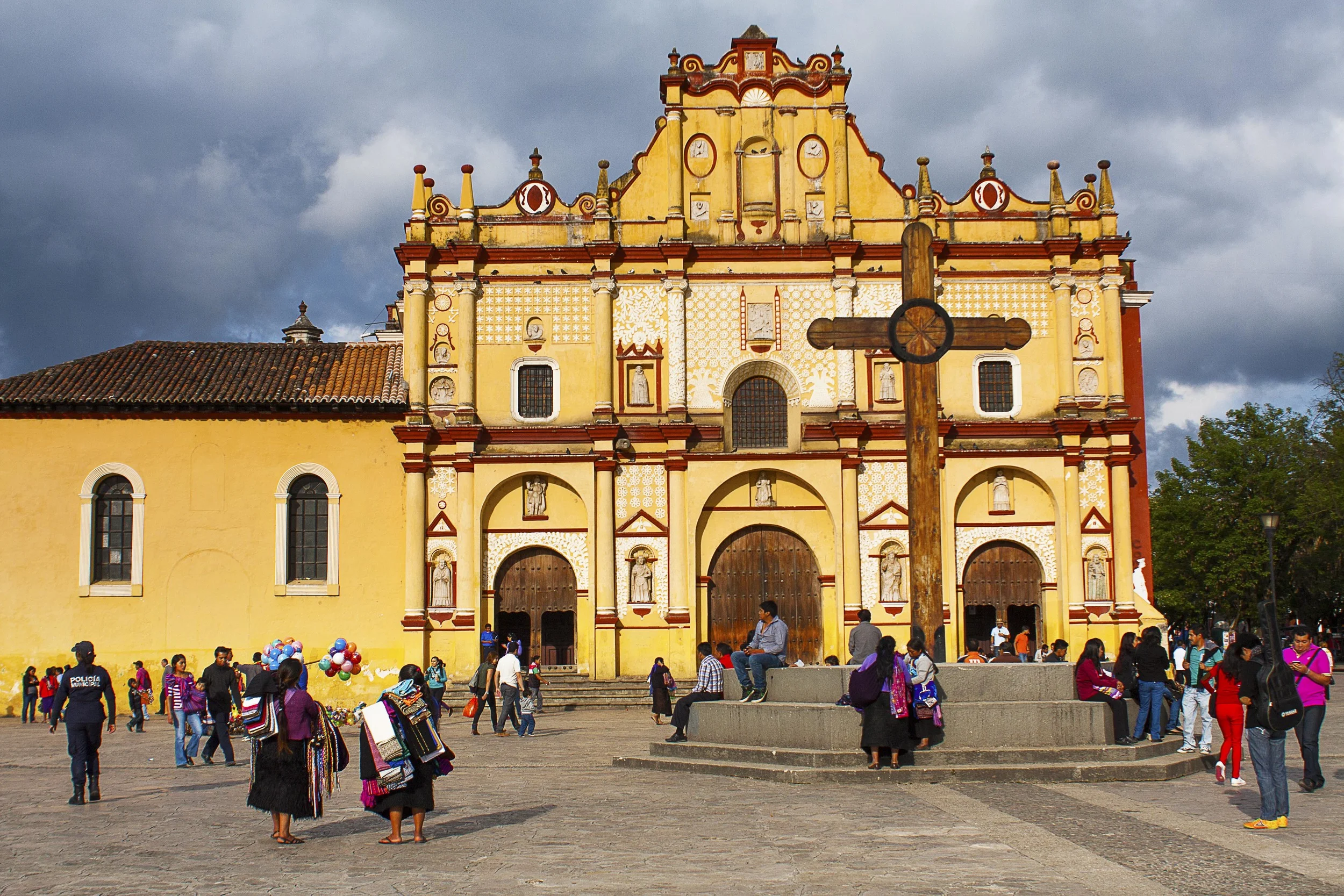 Day 124 - San Cristobal de las Casas, Chiapas, Mexico A beautiful colonial town where old and new still lives on. A great majority of Tzotzils, a Mayan group, live in the town and surrounding communities. Chiapas is also home of the controversial Zapatistas who fought against the government for social equality for the indigenous people. Much of the people or architecture remind you of the fight for existence from the indigenous people. You will find numerous different traditional attires on women which hint you what community they are from. Men have long left their traditional clothes for special occasions to avoid discrimination and churches often have Mayan iconography that show how the Spaniards tried and failed to evangelize them. Despite all these tensions and contradictions, this town is full of life, delicious food and friendly people.