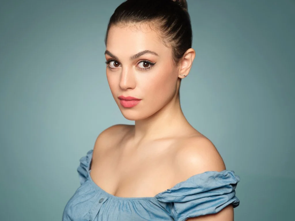 Studio portrait of woman with bare shoulders