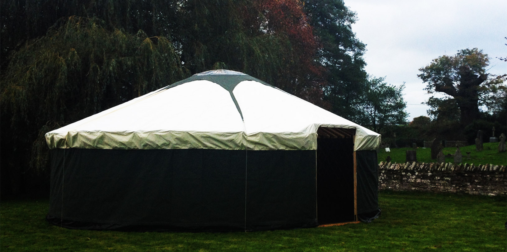 30ft yurt with green walls.