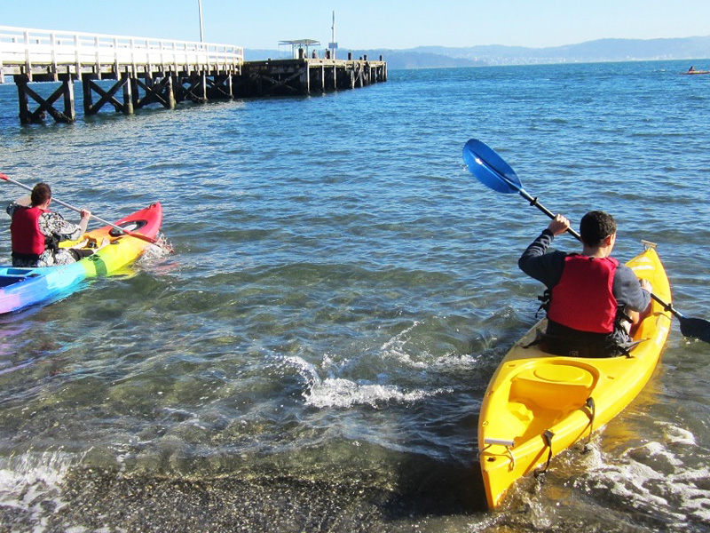 3x4 small kayaks setting out from beach.jpg