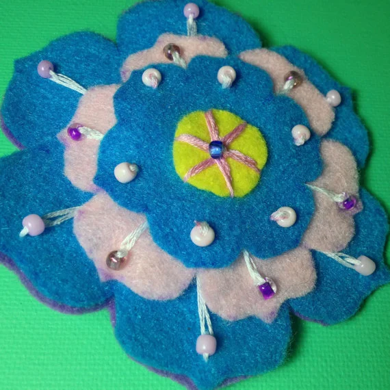 Pink and blue felt flower brooch.