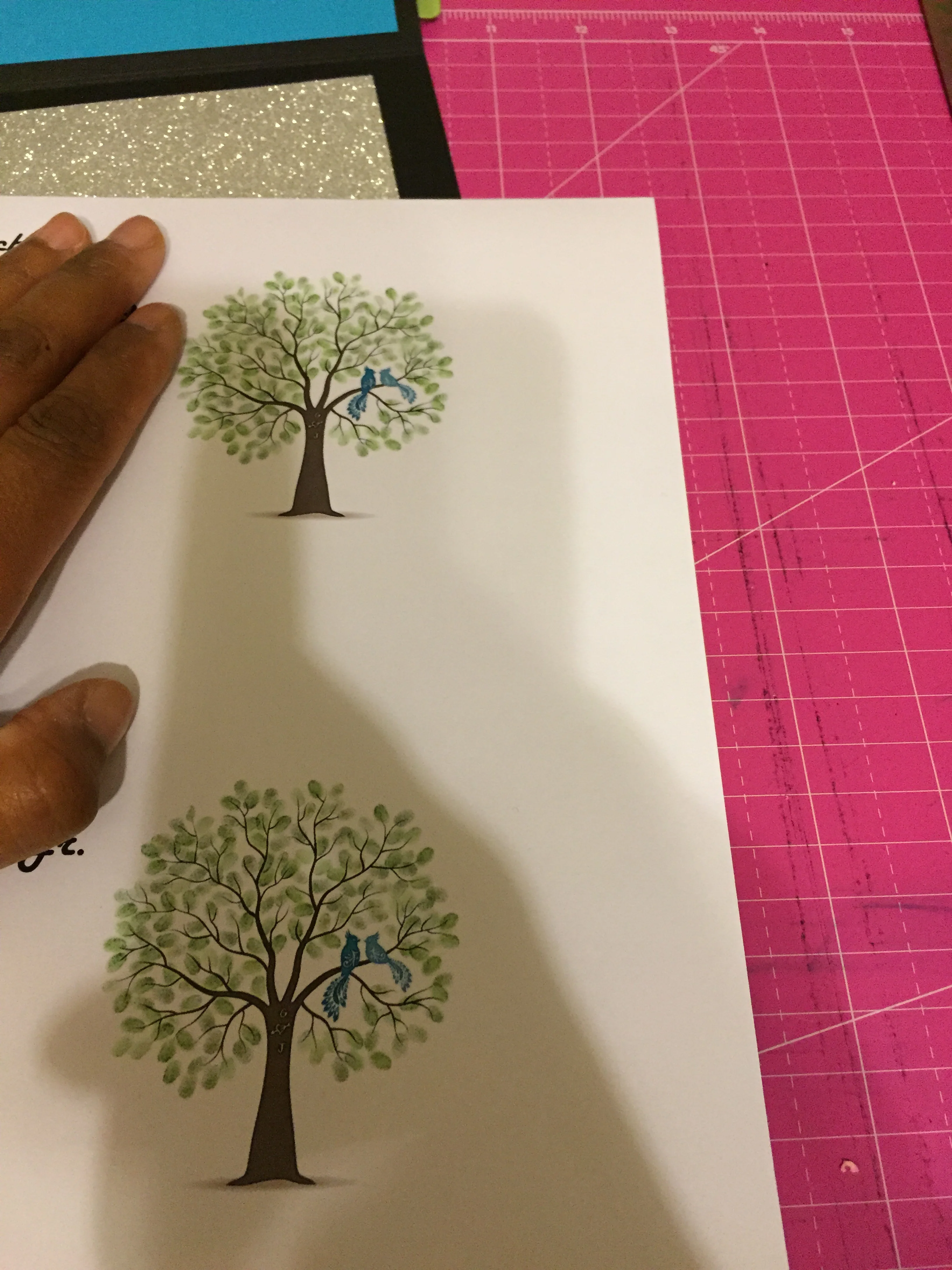 Tree graphic with 2 little birdies.