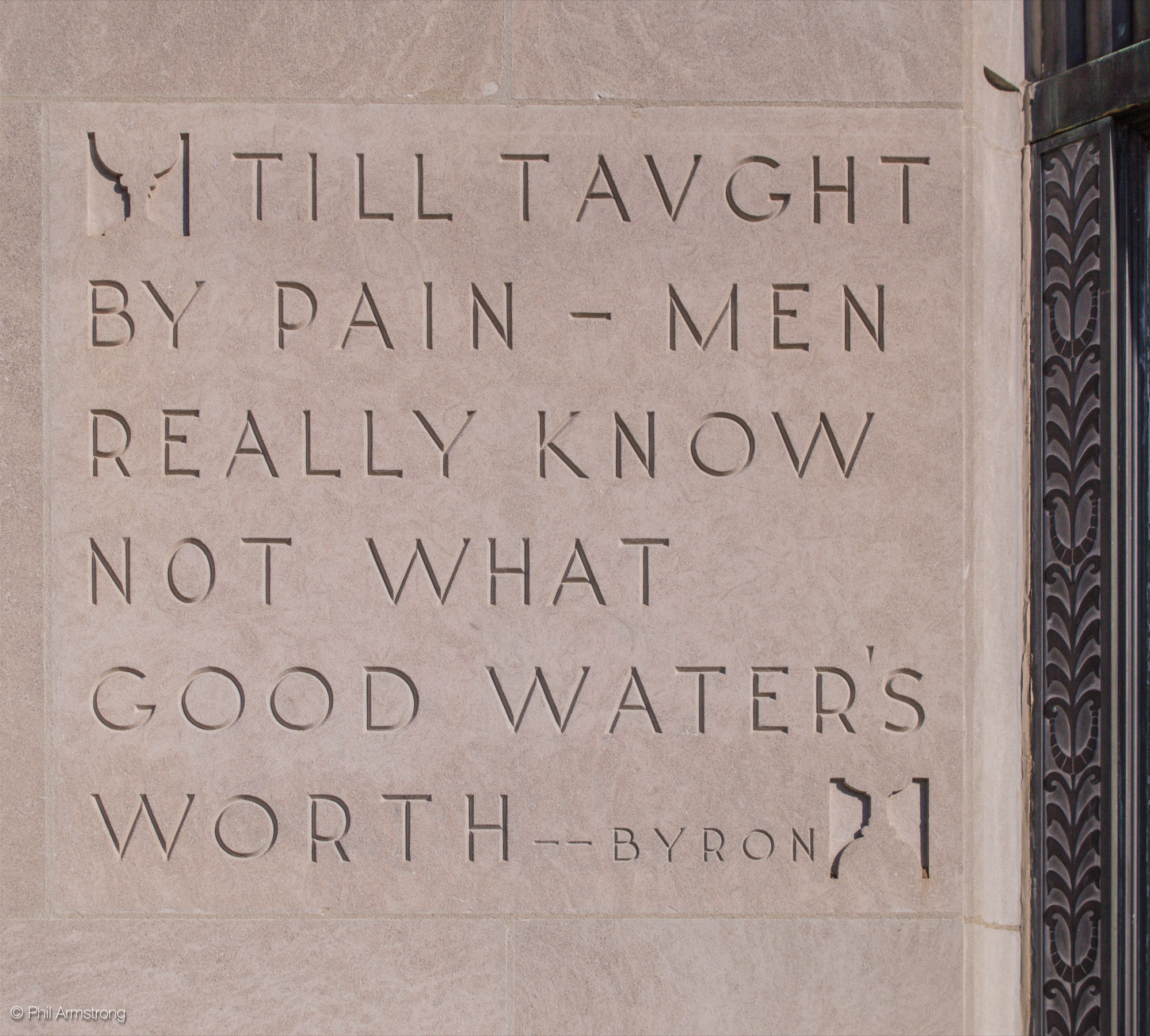 An inscription of a quote from Lord George Gordon Bryon, an English poet from the early 19th century, etched into the limestone left of the front entrance.