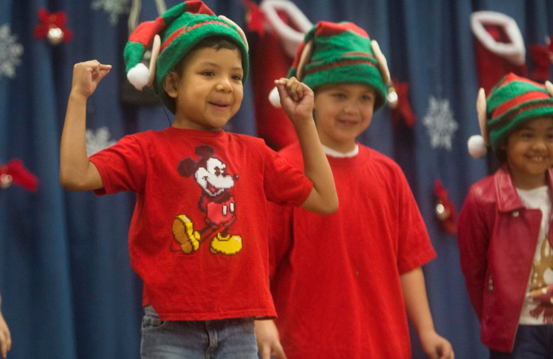  Omar Gallardo, left, performs in a holiday concert presented by Raymond Temple Elementary's Deaf and Hard of Hearing program on Thursday, December 15, 2016. Photography by Drew A. Kelley, Contributing Photographer. 