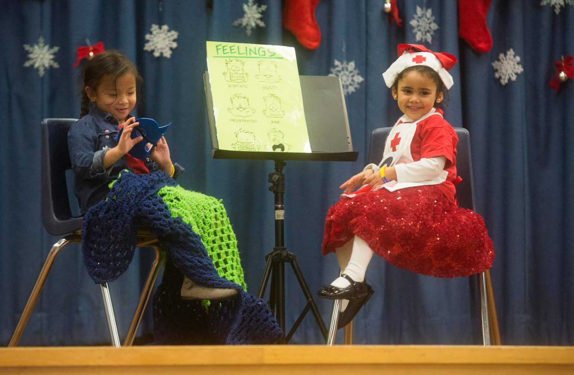  Thanya Ngyuen and Yamileth Zavala perform in a holiday concert presented by Raymond Temple Elementary's Deaf and Hard of Hearing program on Thursday, December 15, 2016. Photography by Drew A. Kelley, Contributing Photographer. 