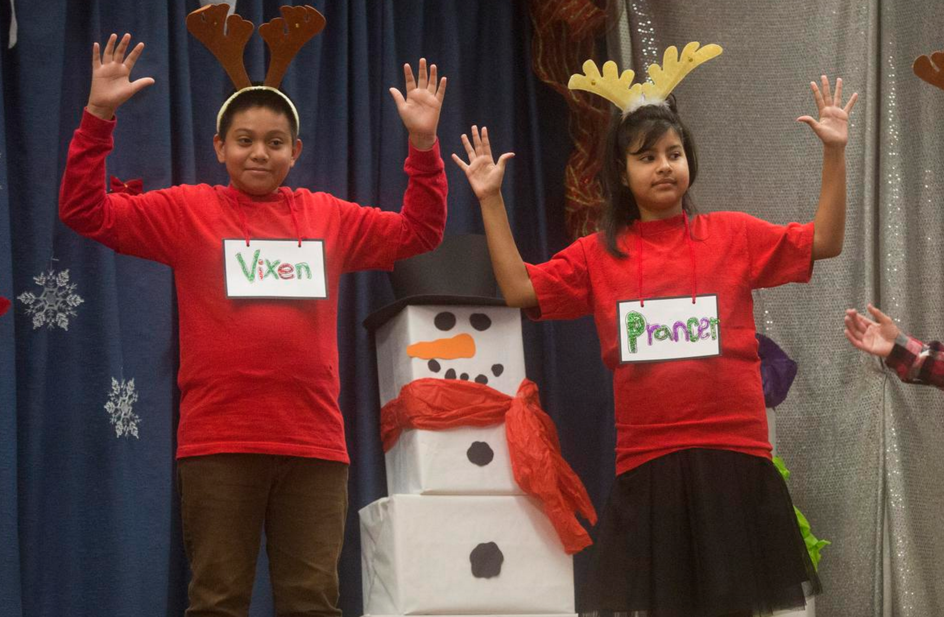  Isai Corrales Cruz and Angely Gonzalez perform in a holiday concert by Raymond Temple Elementary's Deaf and Hard of Hearing program on Thursday, December 15, 2016. Photography by Drew A. Kelley, Contributing Photographer. 