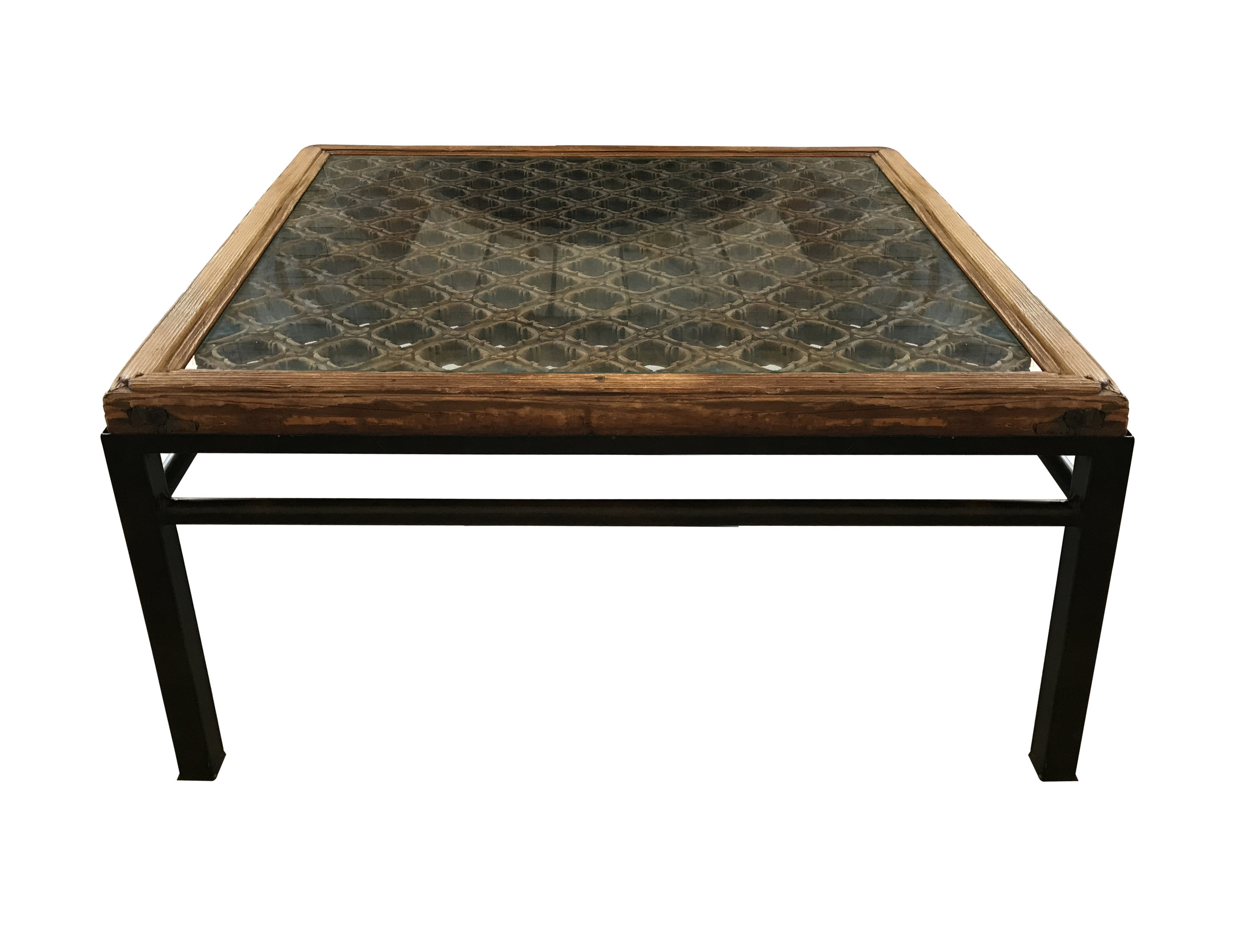  The core of this coffee table is an antique Chinese screen. 
