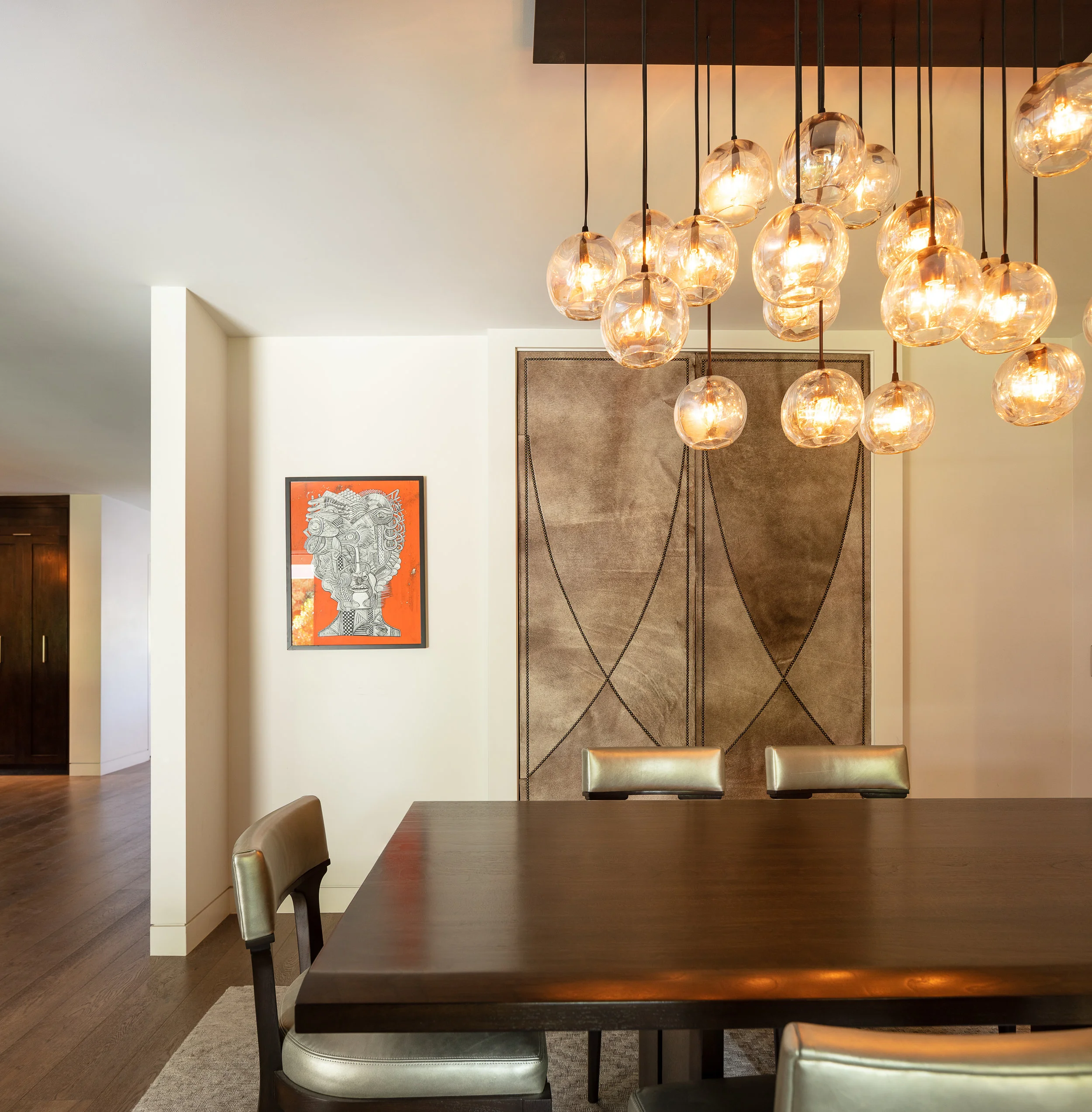 DINING ROOM WITH TOUCH LATCH HAIR-ON-HIDE DOORS TO EXTRA STORAGE AREA
