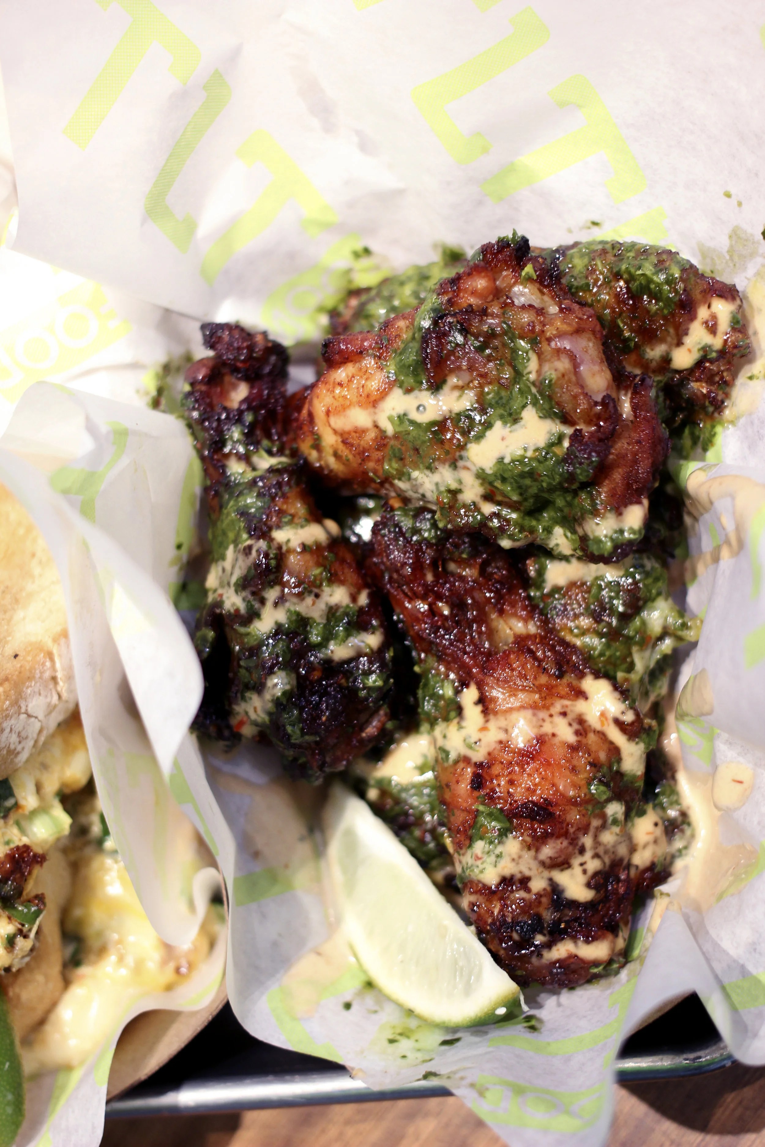 Amazing Chimmi Wings - Tossed in Chimichurri & Topped with Chipotle-Honey Aioli. Green Apple & Lime Garnish. 6 Wings total. These were one of the best wings I've had! Not comparing them to your typical bar wings or game day wings, but the flavor of these are so different than anything I've ever had. Must order. The lime does wonders to this as well.