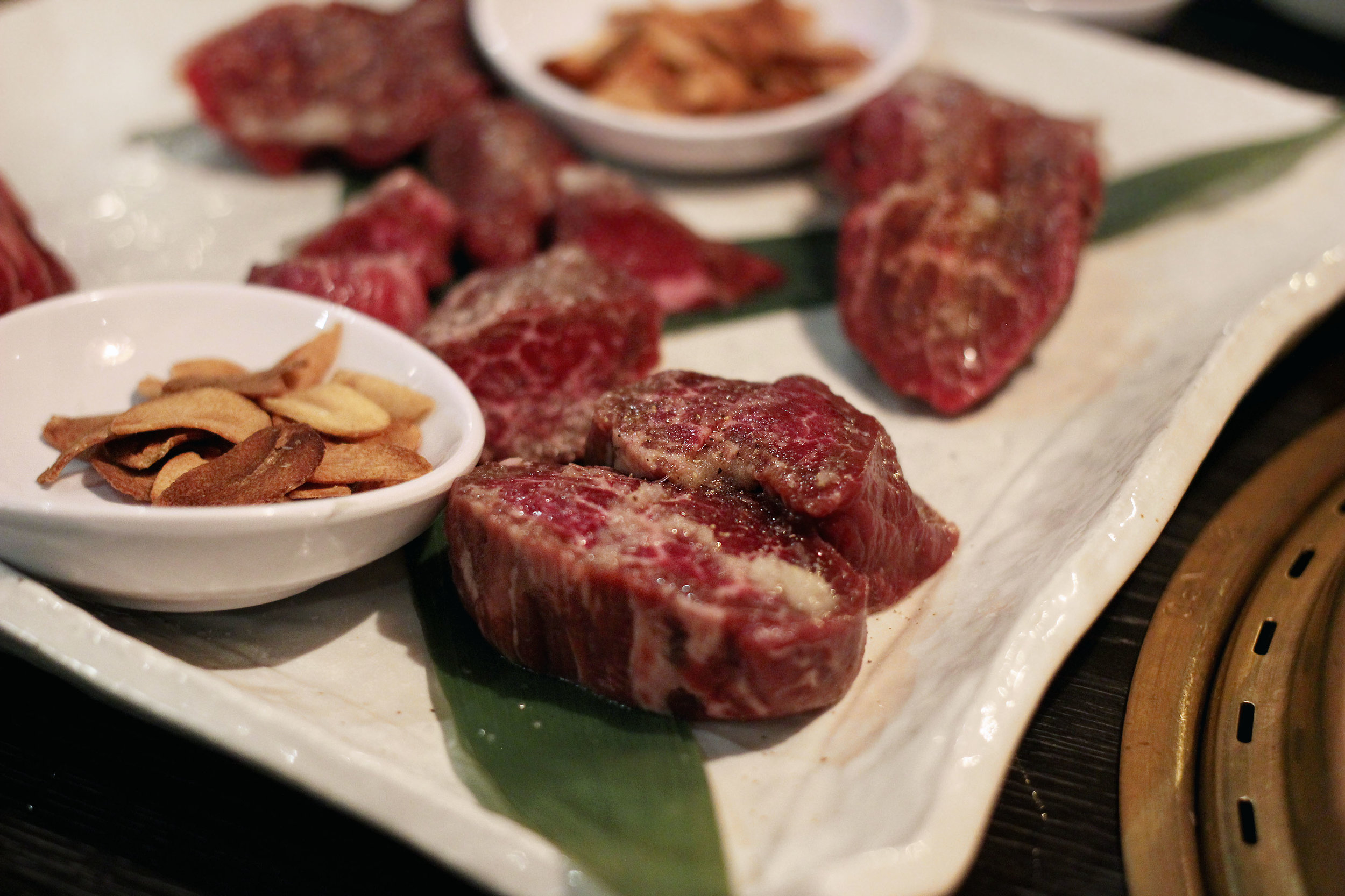 Kobe Fillet Mignon - Cubed Kobe with ponzu sauce and fried garlic chips.