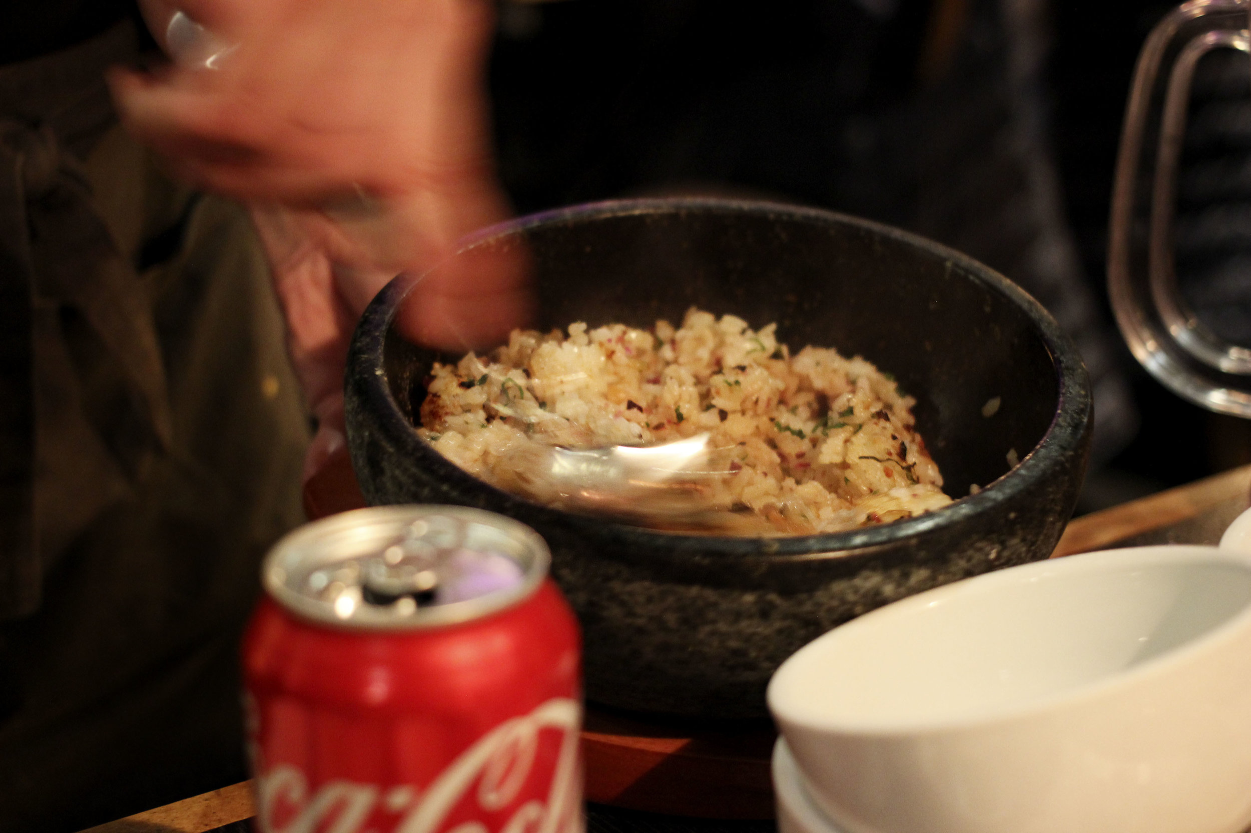 Garlic Rice - Garlic Fried rice with pickles in a stone pot.