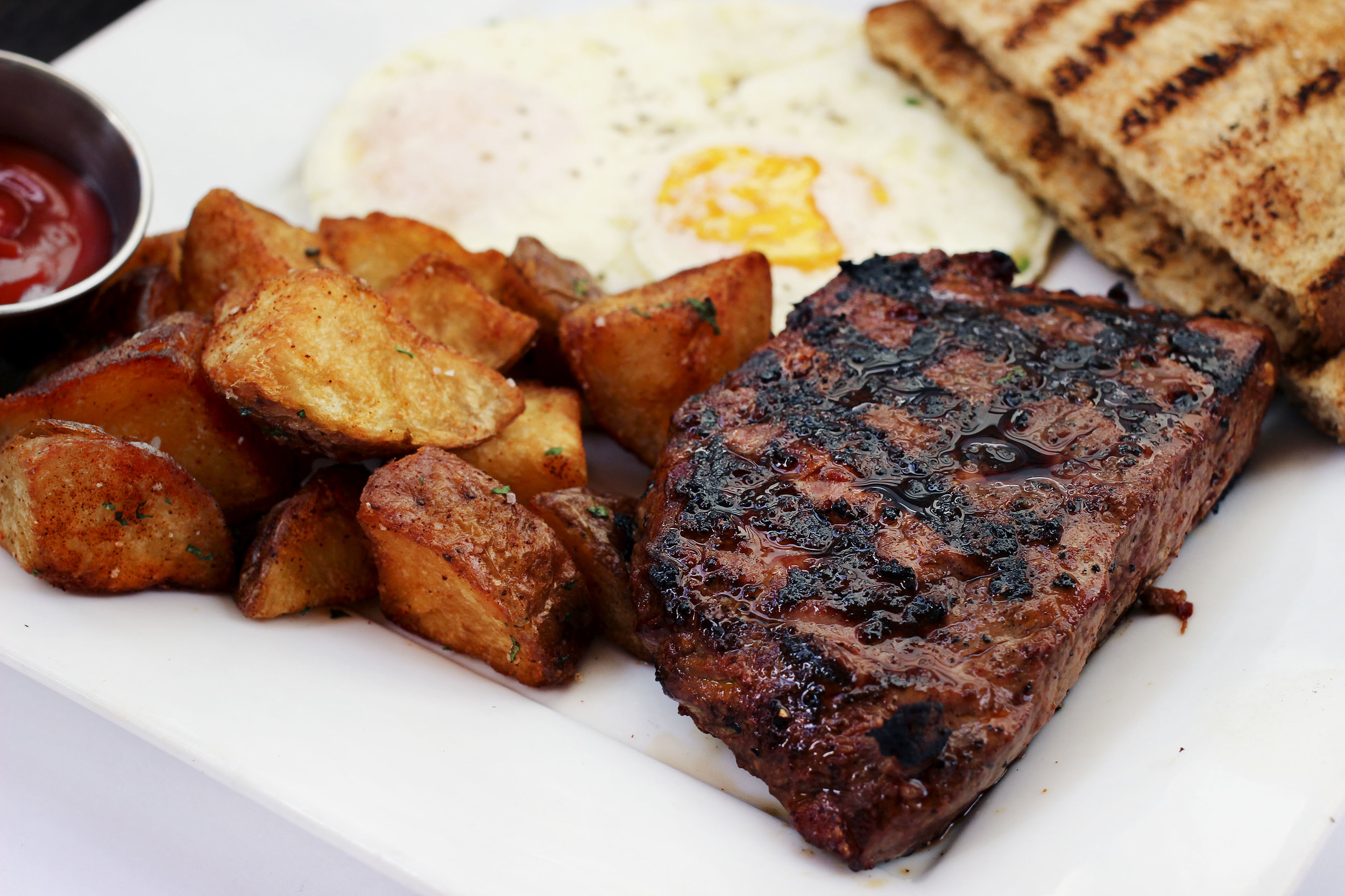 Flatiron Steak, roasted potatoes, eggs, and toast. The flatiron was cooked perfectly, extremely tender, ridiculously juicy.