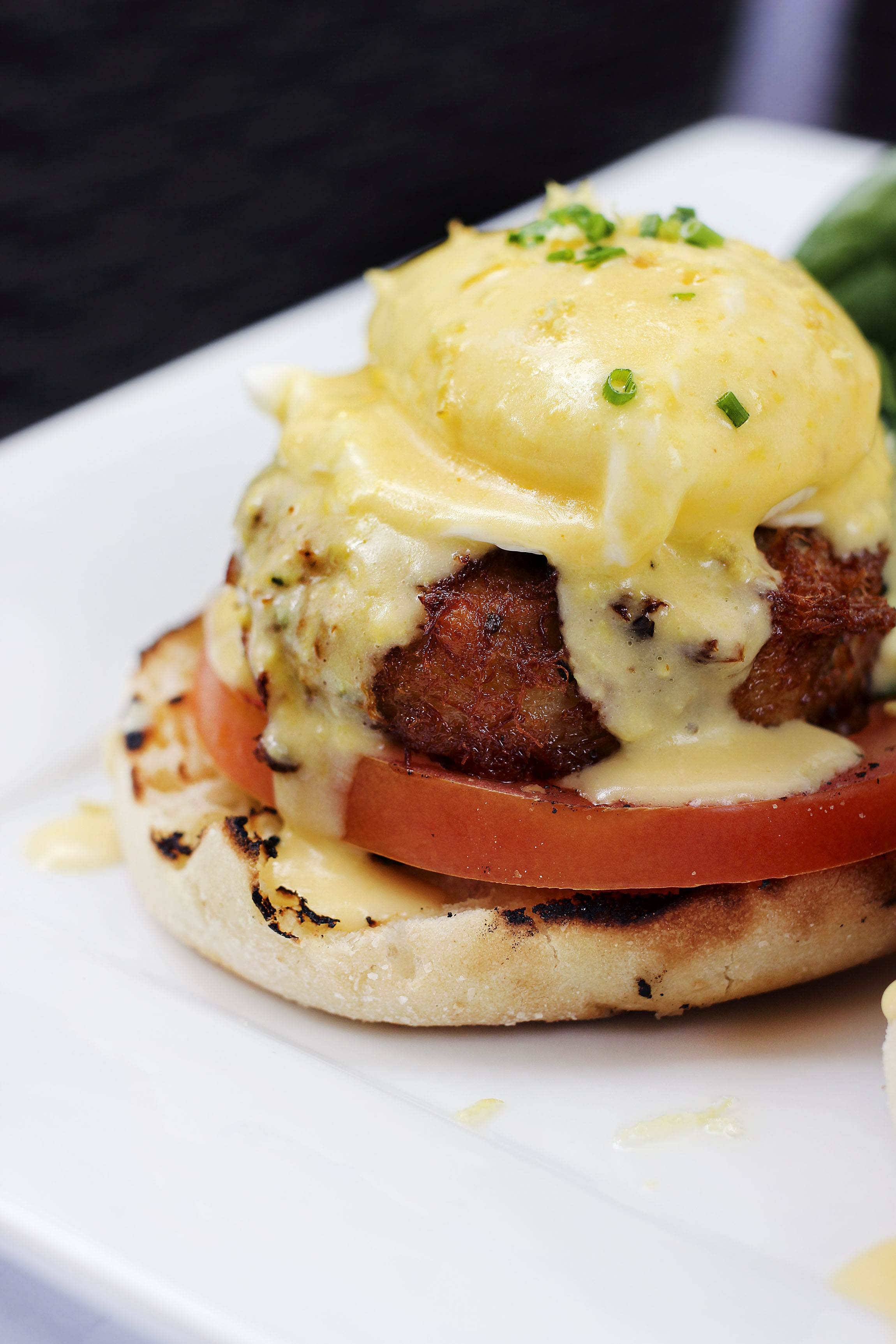 CRAB CAKE BENEDICT - Loaded Crab Cake, grilled tomato, poached eggs, English muffin, and topped with a lemon hollandaise sauce. What I couldn't get over was the lemon hollandaise. Such a slight citrus touch, but made the dish very bright.