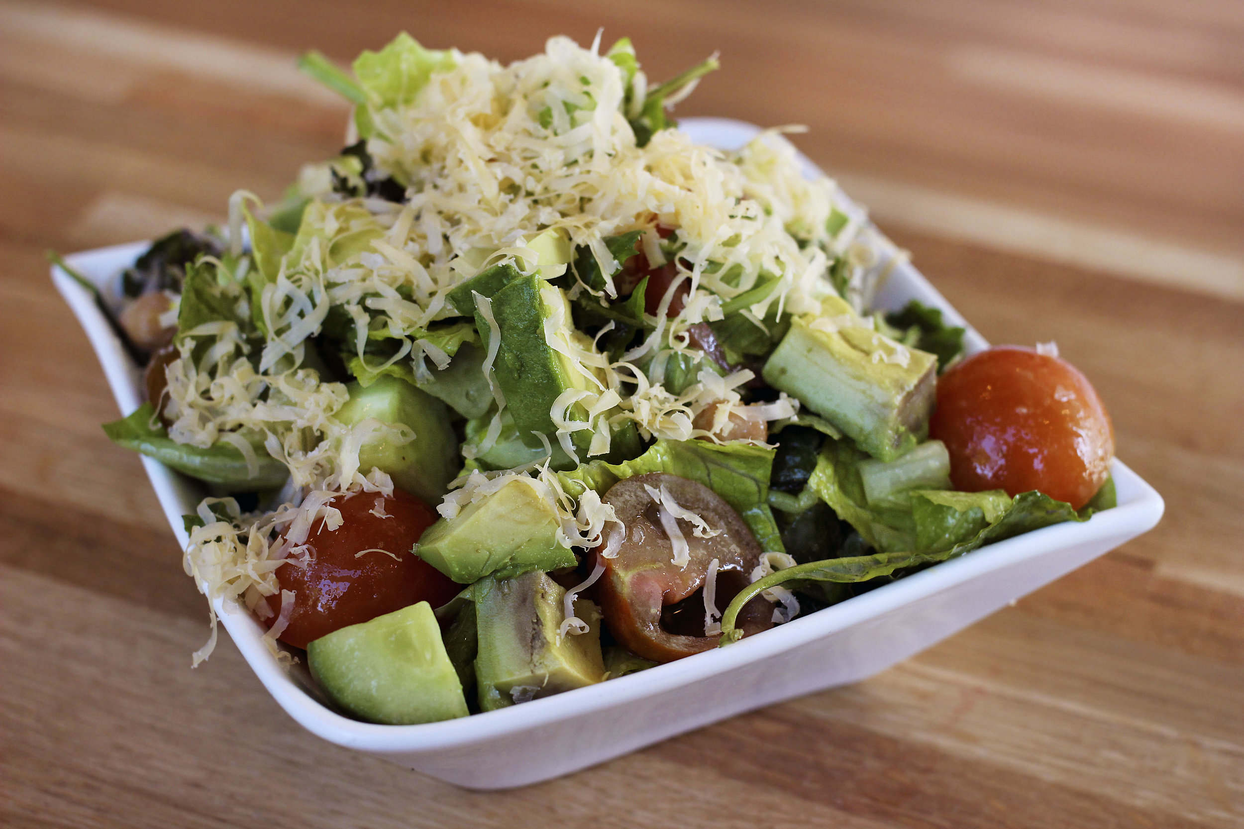 Chop Houz (VG) - Chopped Baby Romaine & Kale, Heirloom Tomatoes, Chickpeas, Red Onion, Fresh Herbs, Cucumbers, Avocado, Honeyed Walnuts, Topped with Premium Aged Cheddar Served with Chive-Honey-Dijon Dressing. Refreshing and delicious. The Aged Cheddar added a nice nutiness to this salad.