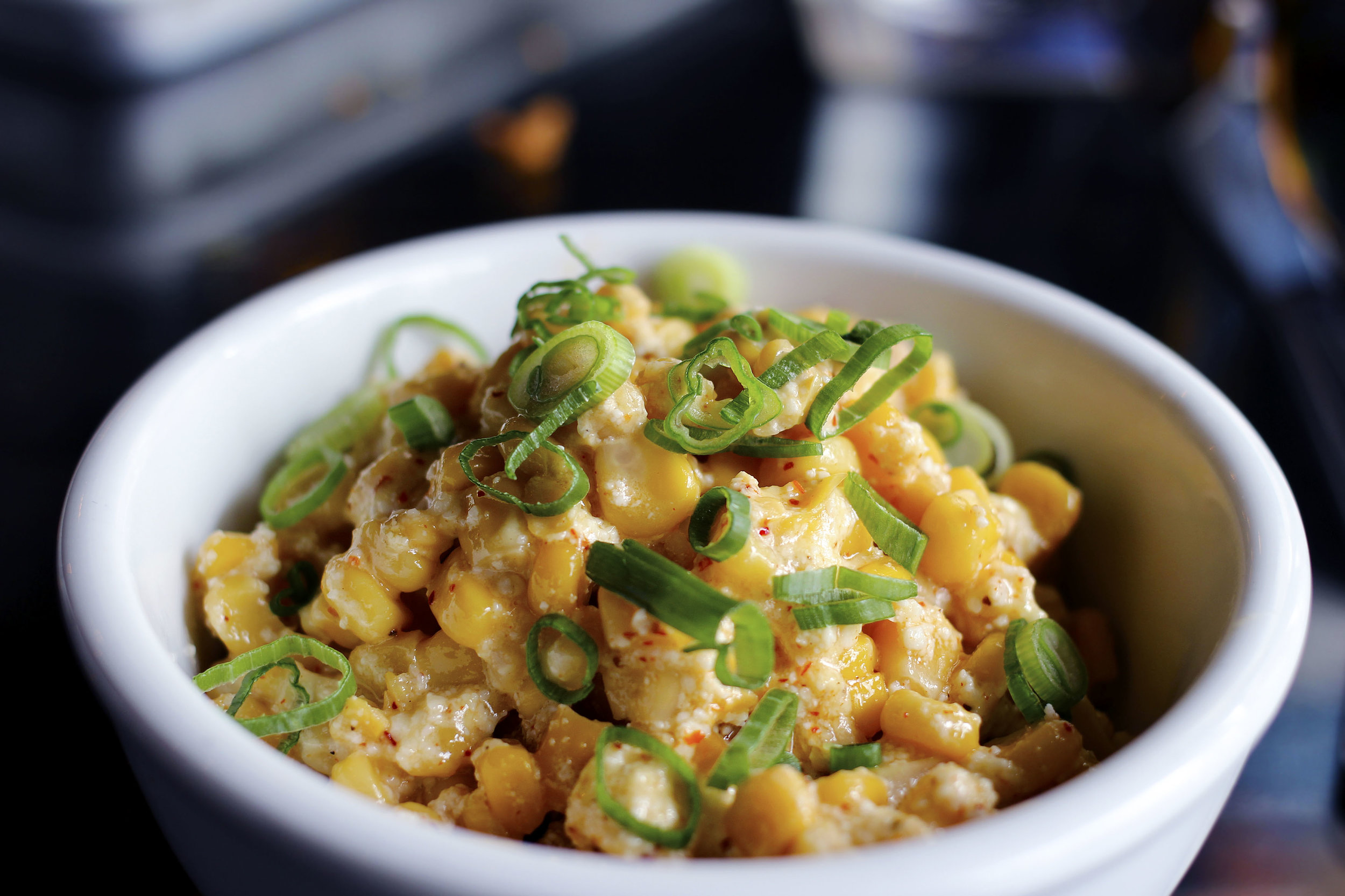 Elote - Fresh corn with garlic aioli, cotija cheese, tajin.