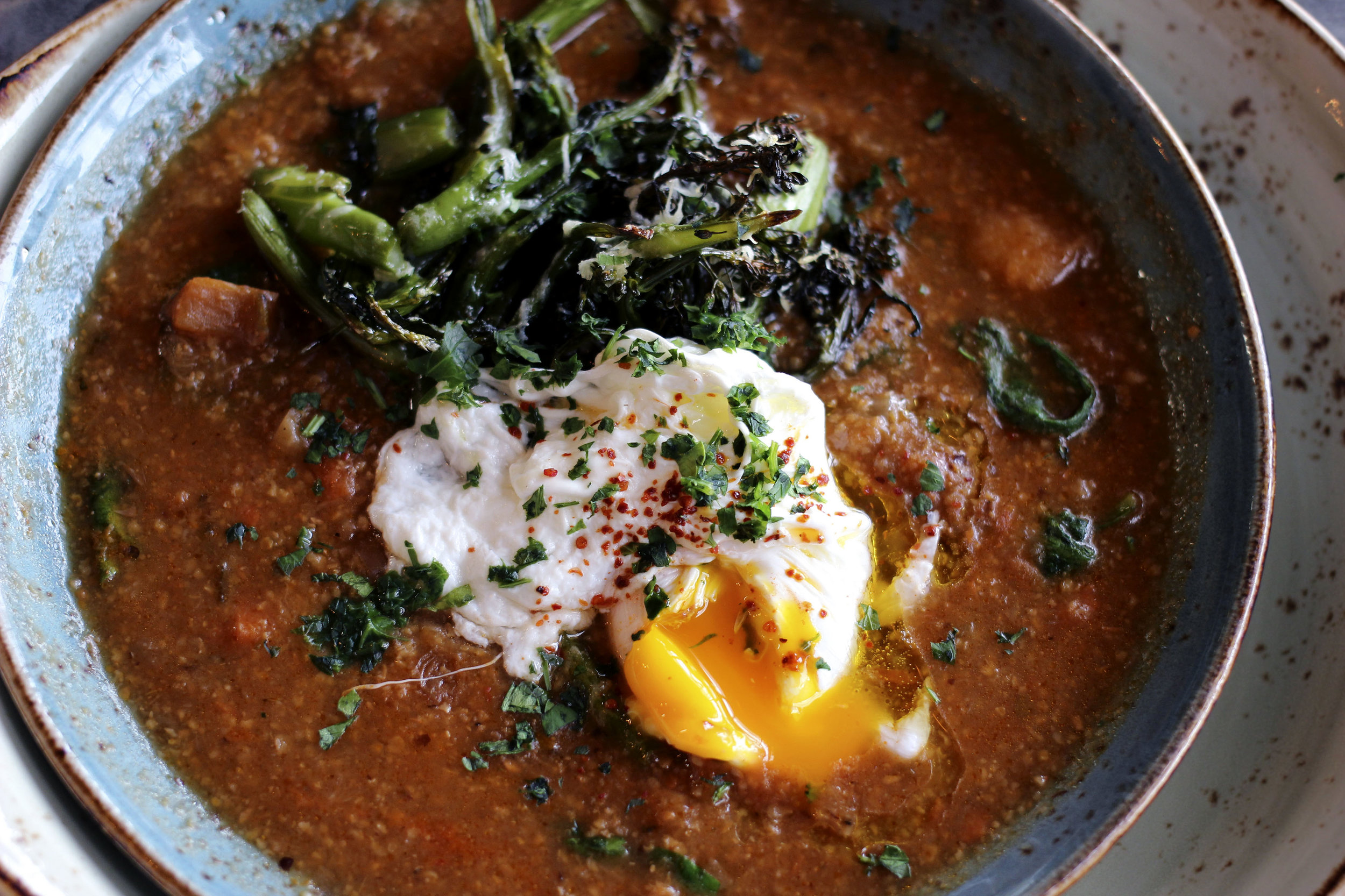 Polentina & Root Vegetable Bowl - red flint polenta and tomato-chile broth, poached egg, roasted broccolini, pecorino