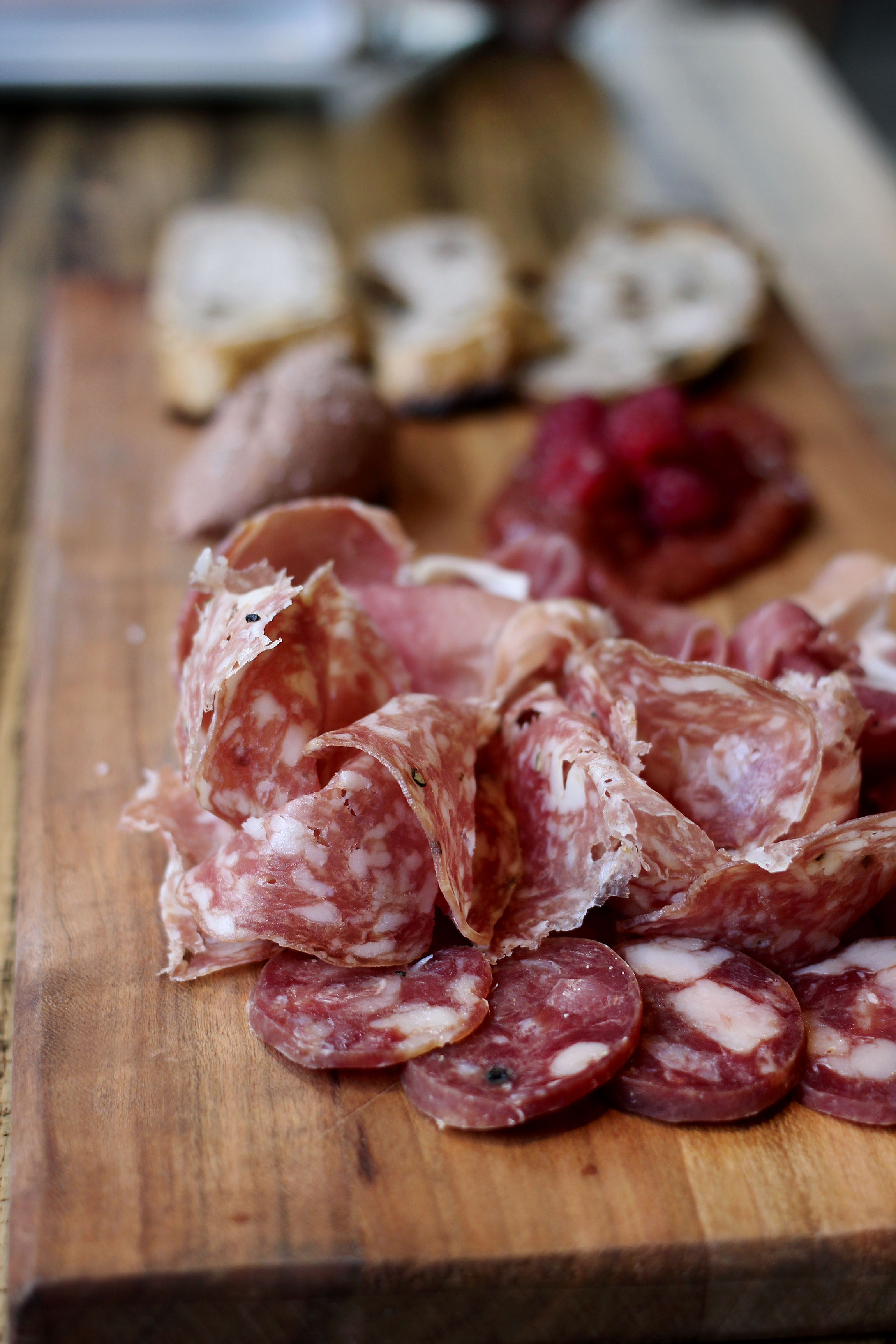Charcuterie - Prosciutto, duck salumi, soppressata, housemade brandied chicken liver pâté, seasonal jam, and charred rustic bread