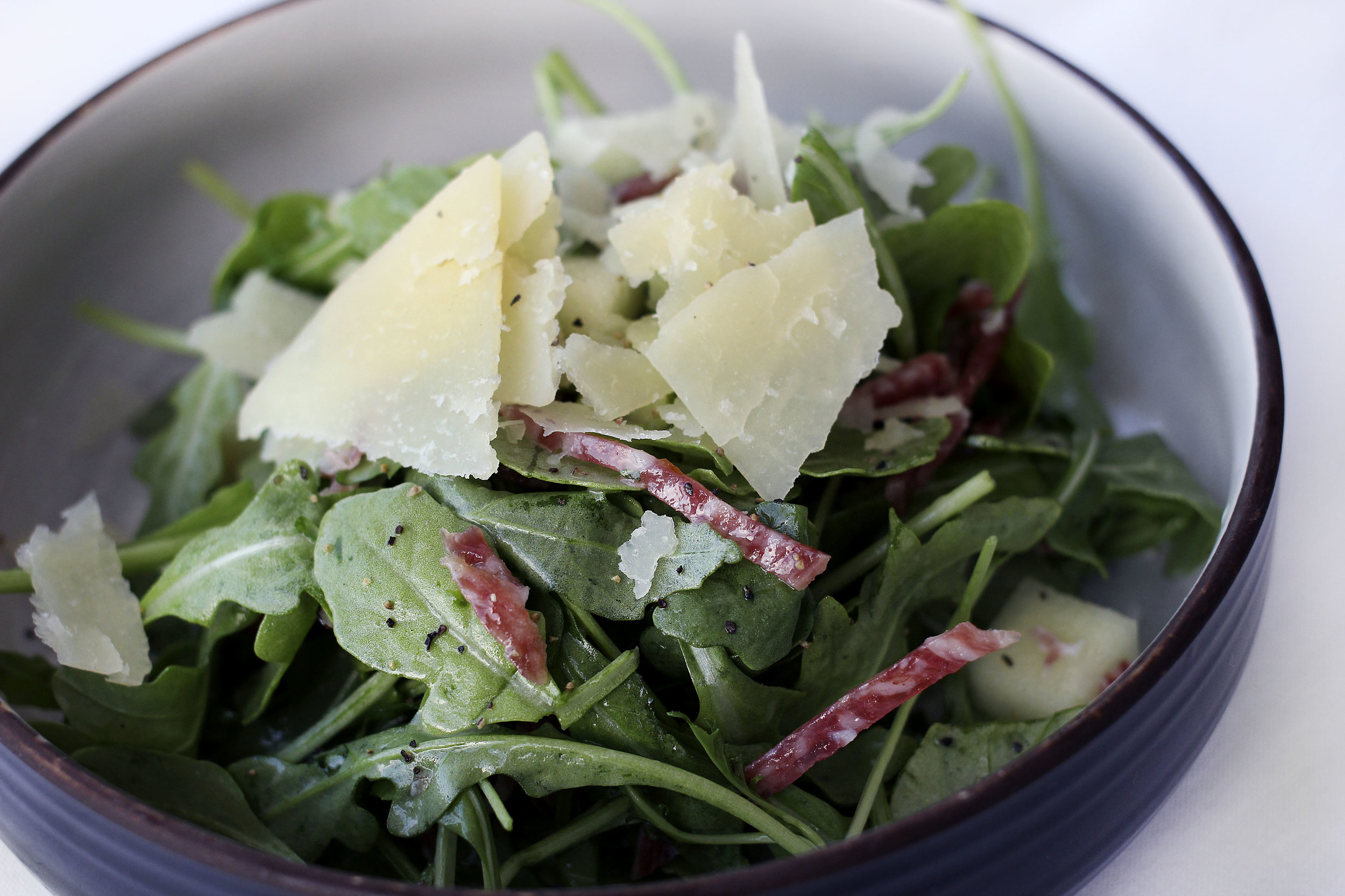 Rucola con Pecorino arugula, crisp apple, applewood smoked salami shaved pecorino toscano, white balsamic