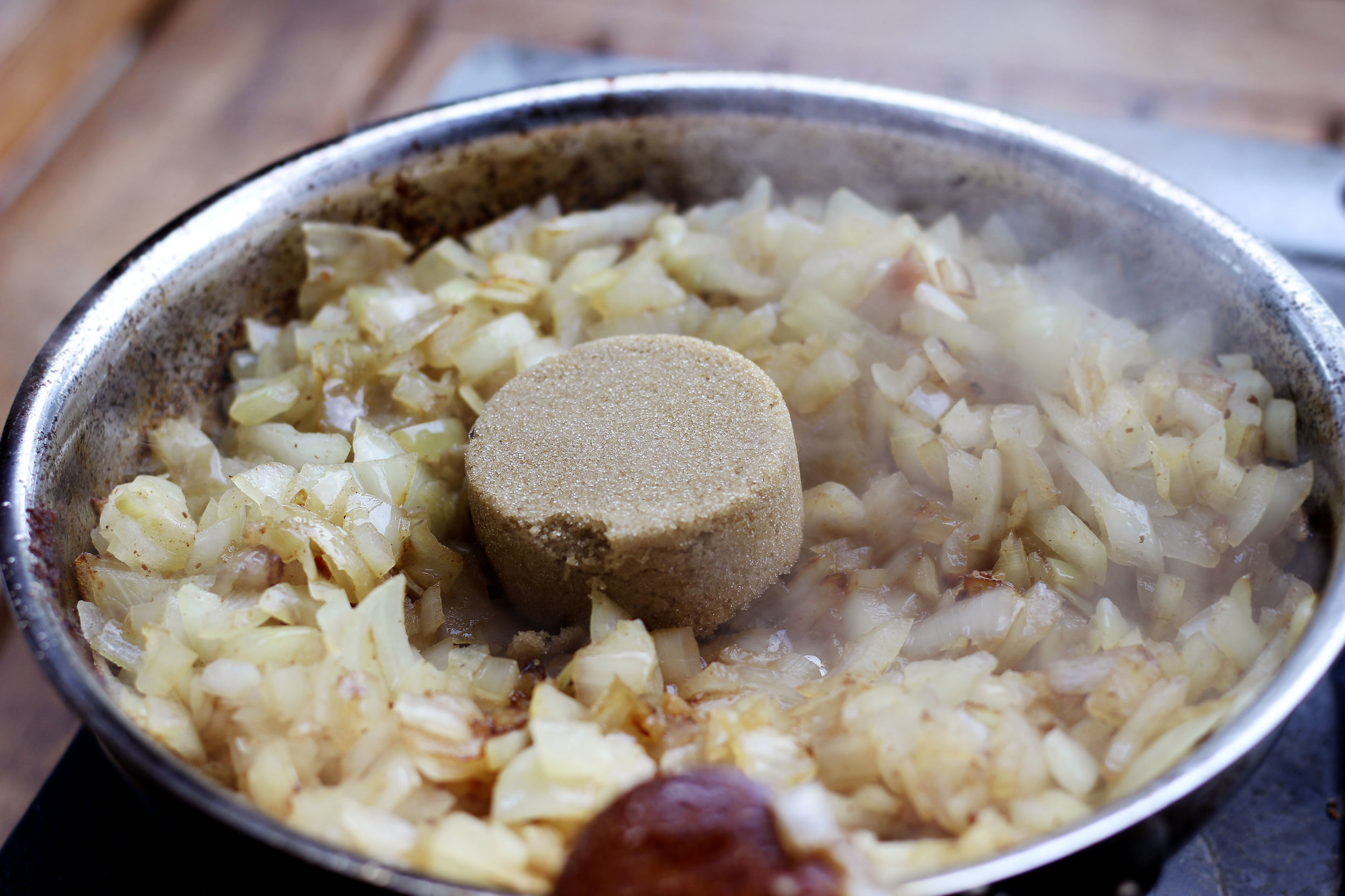 1/4 of brown sugar is dropped in when onions start turning translucent. 