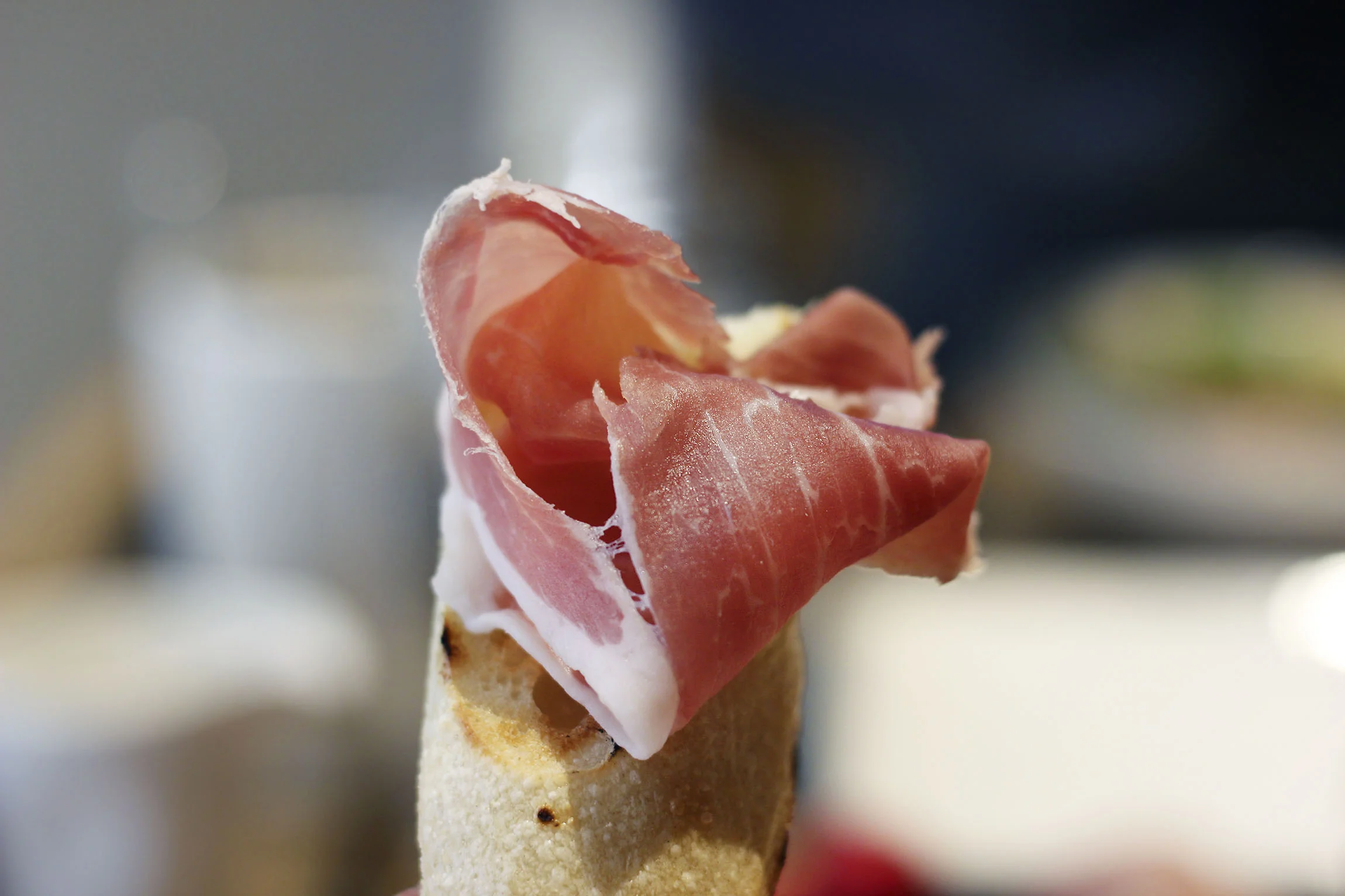 Prosciutto loving with charred bread.