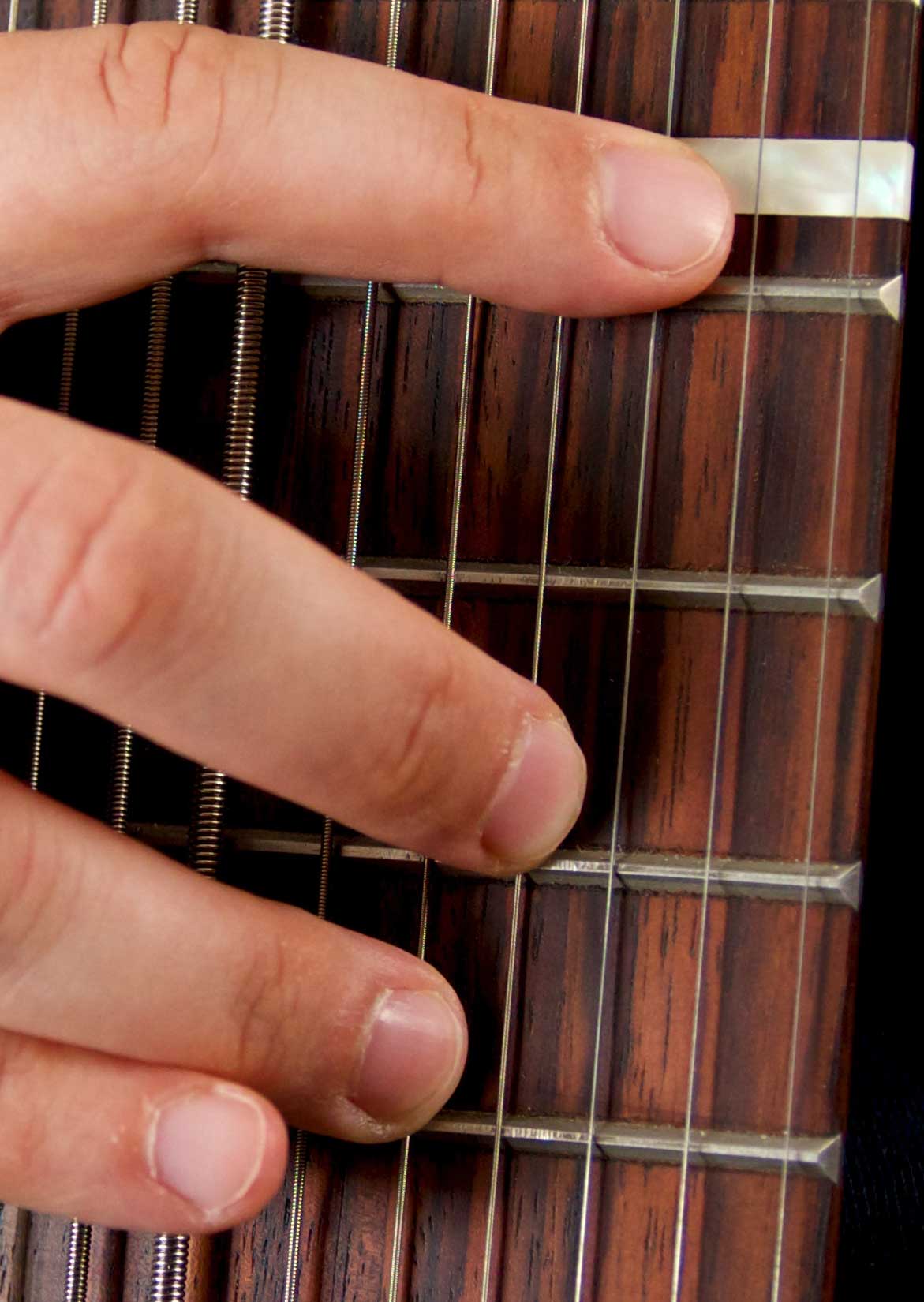 A Major triad played in the melody. The picture is taken using a 12-string Stick, the staff lines represent the inner five strings.