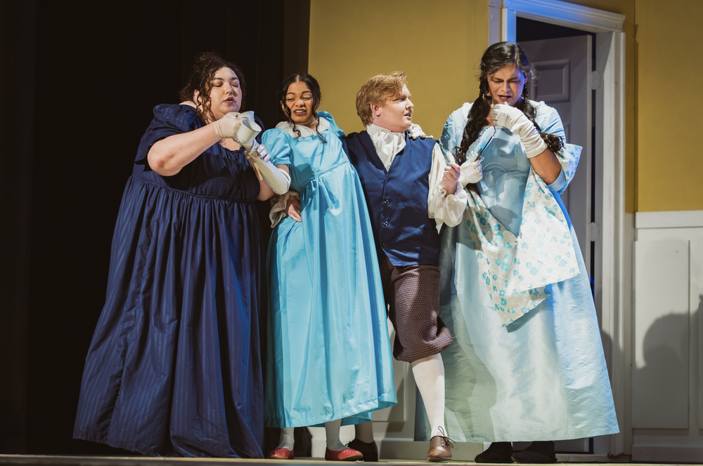  Anna Prelosky as Lizzy Bennet, Alex Castro as Lydia Bennet, Derek Smith as Mr. Bennet, and Shannon Dean San Nicolas as Mary Bennet in Kate Hamill’s  Pride and Prejudice.   Photo: Steph Balagot  Costumes: Christian Jay Santiago  Set and Lighting Desi