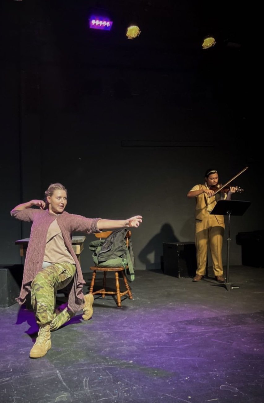  Madison Scott as The Poet and Shannon Dean San Nicolas as The Muse in  An Iliad.    Photo: Steph Balagot  Set and Lighting Design: Troy McVey 