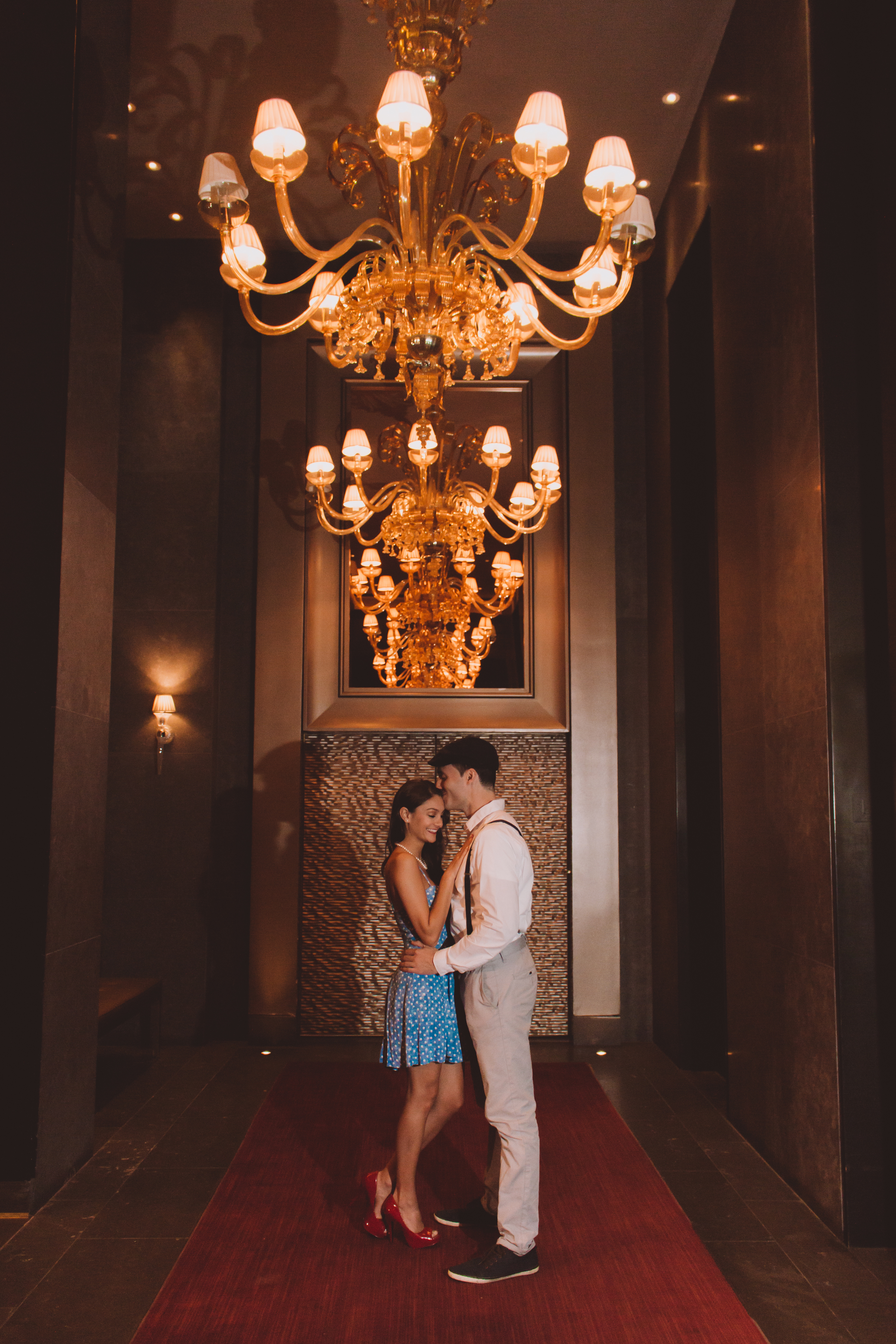 red carpet chandelier engagement photography