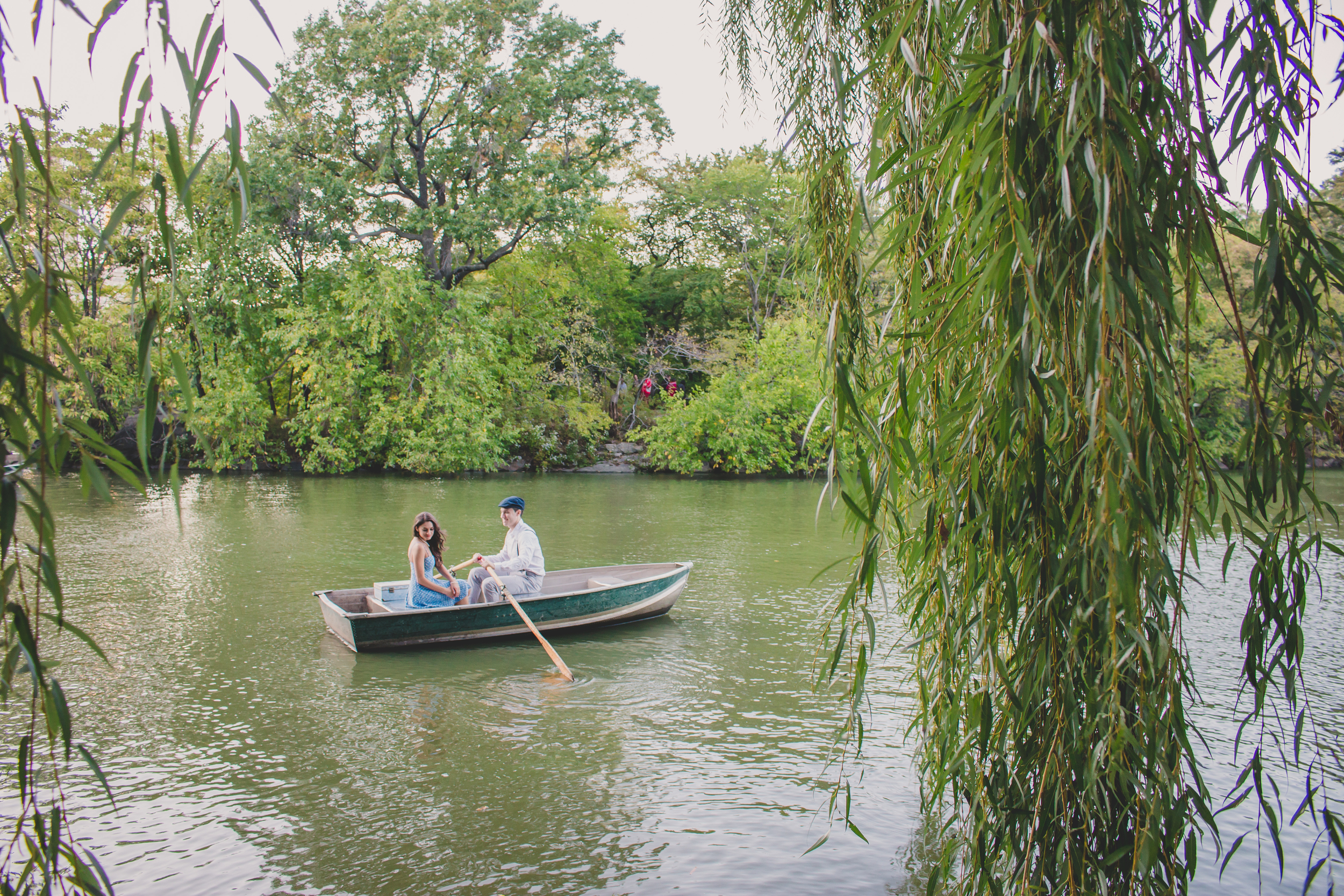 central park nyc engagement session on rowboat