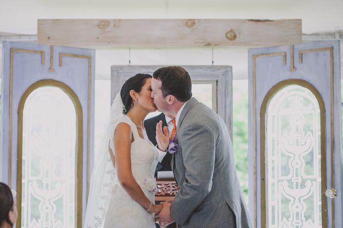 couple kissing at wedding